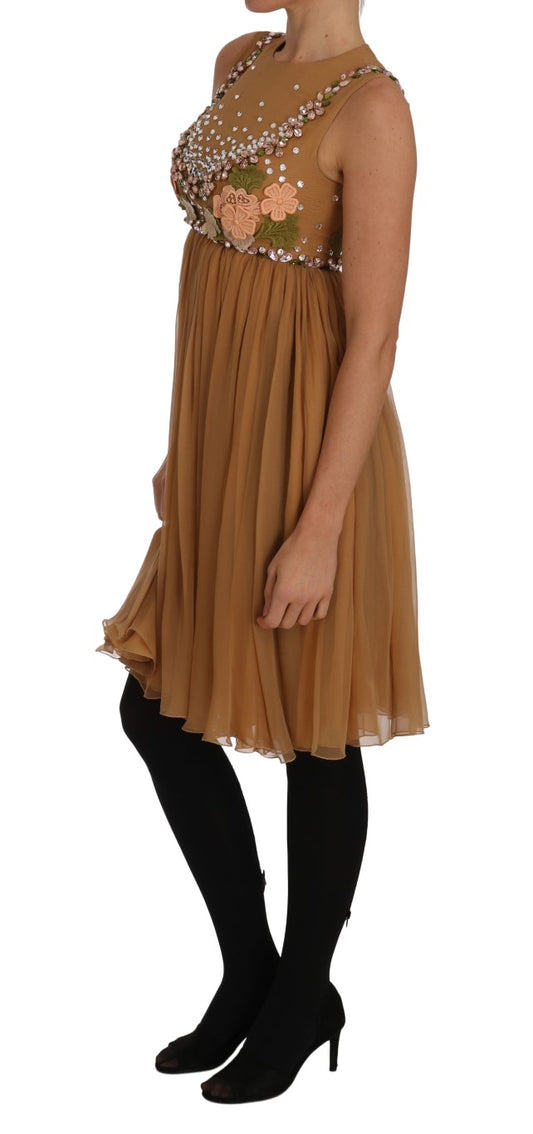 Brown dress with gold sequins, long sleeves and skirt, worn by a model