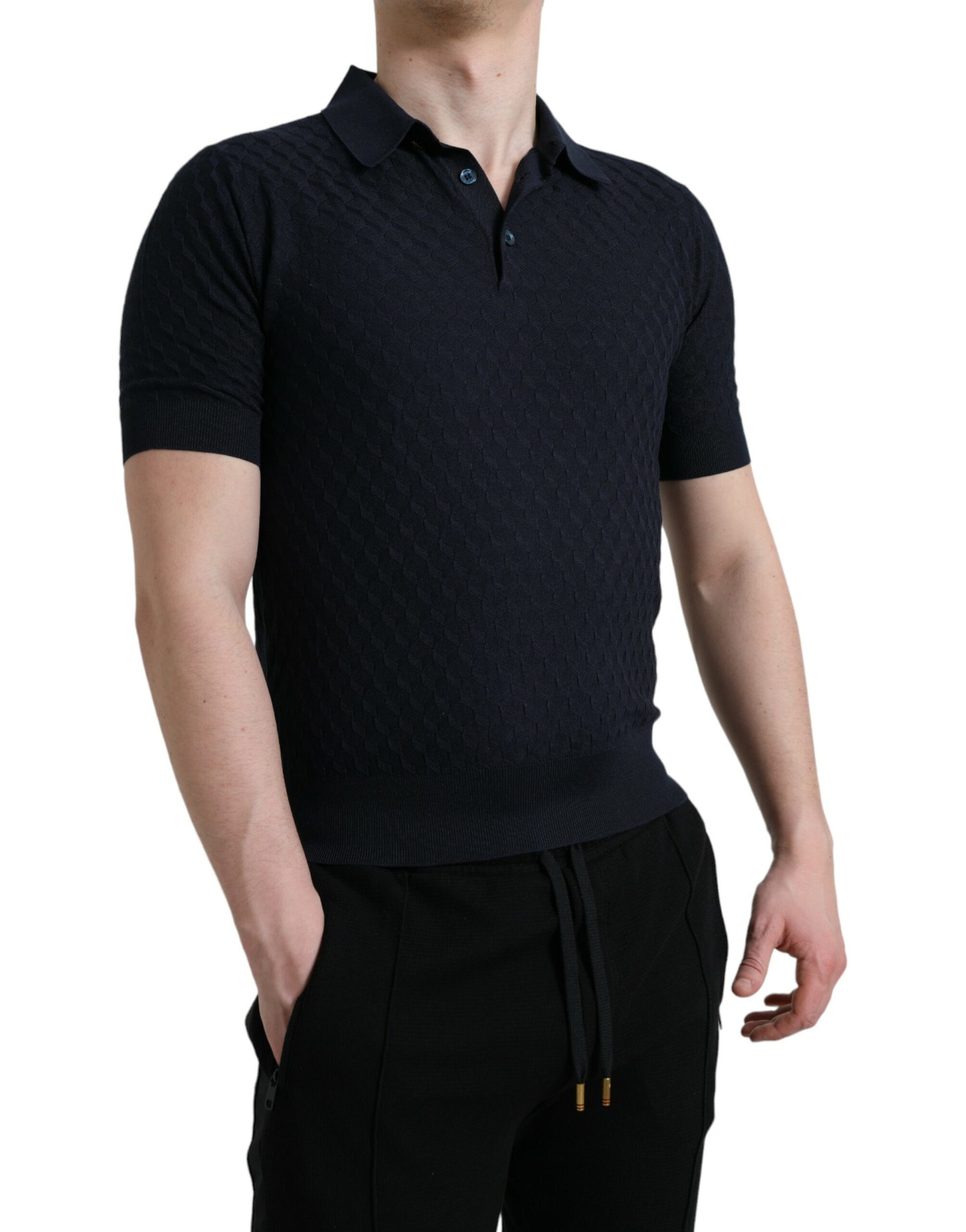 Man wearing dark polo shirt and black pants