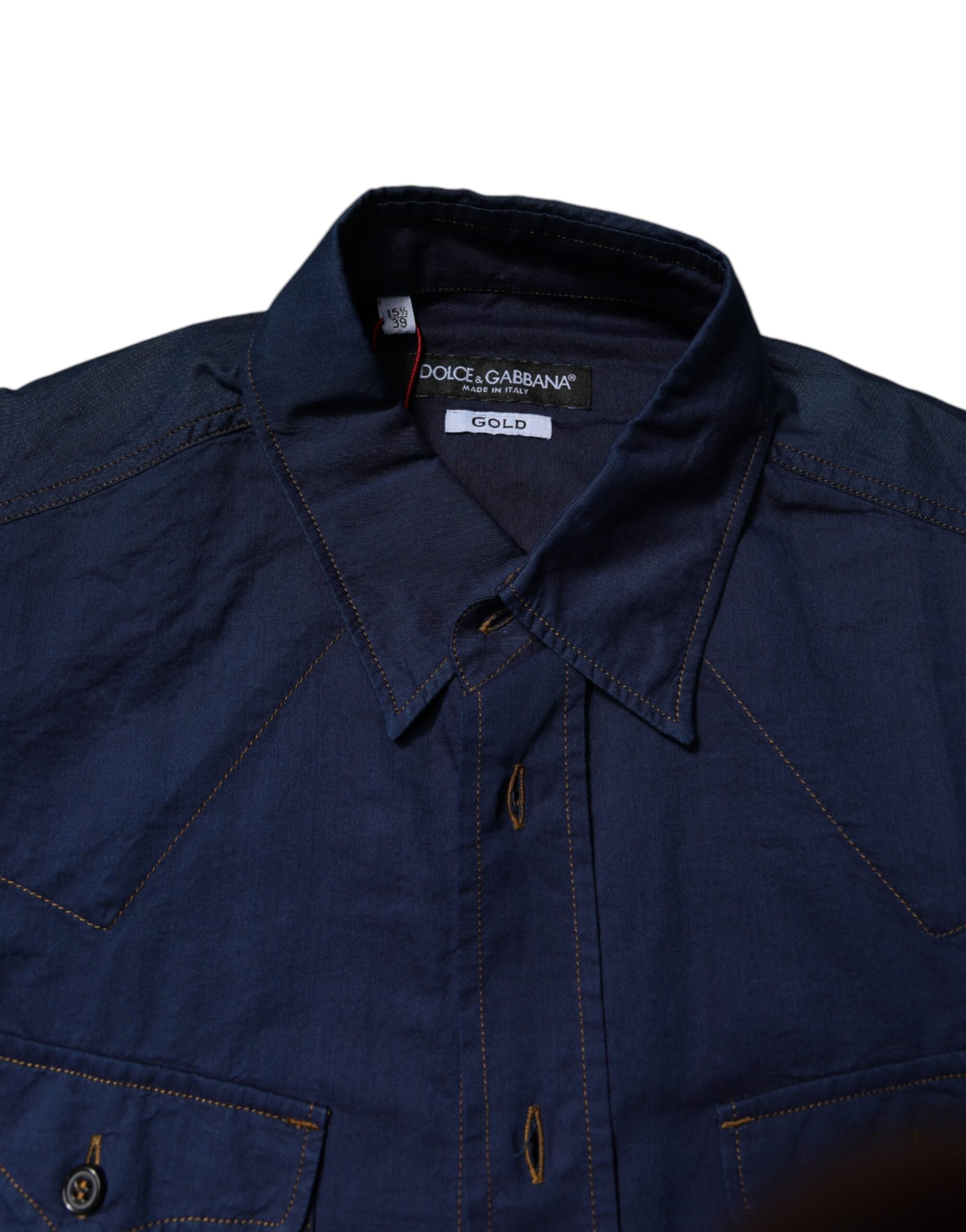 A dark blue denim shirt with gold buttons and a collar, from the brand Dolce & Gabbana
