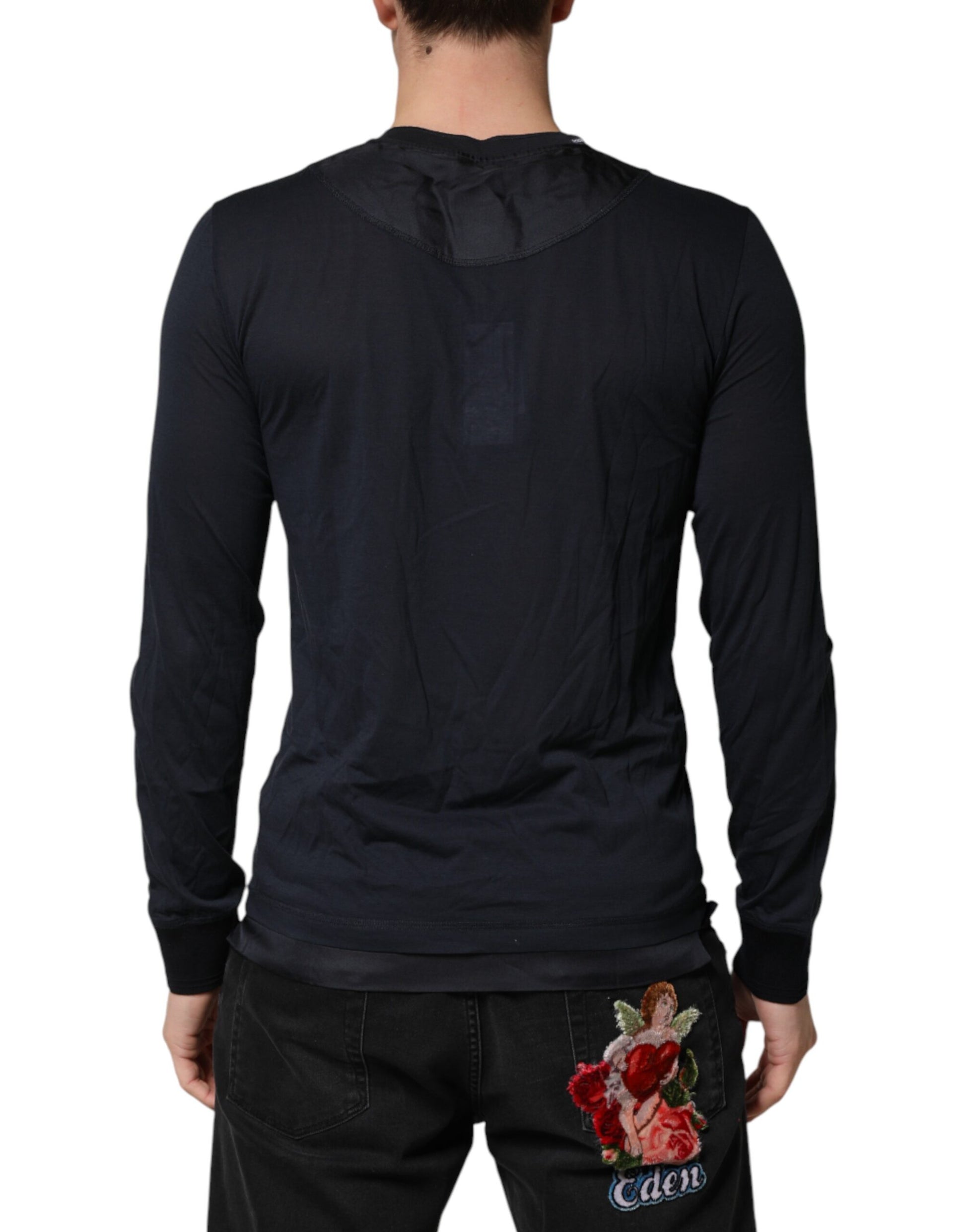 Man wearing long sleeve shirt and jeans