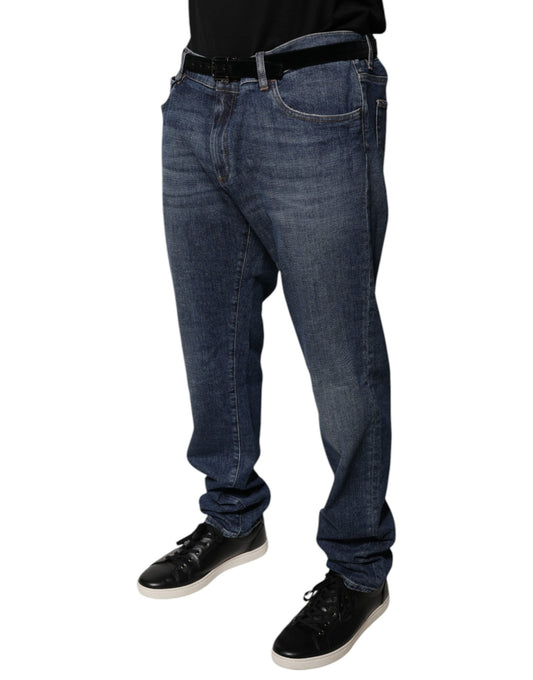 Man wearing blue jeans and black shoes