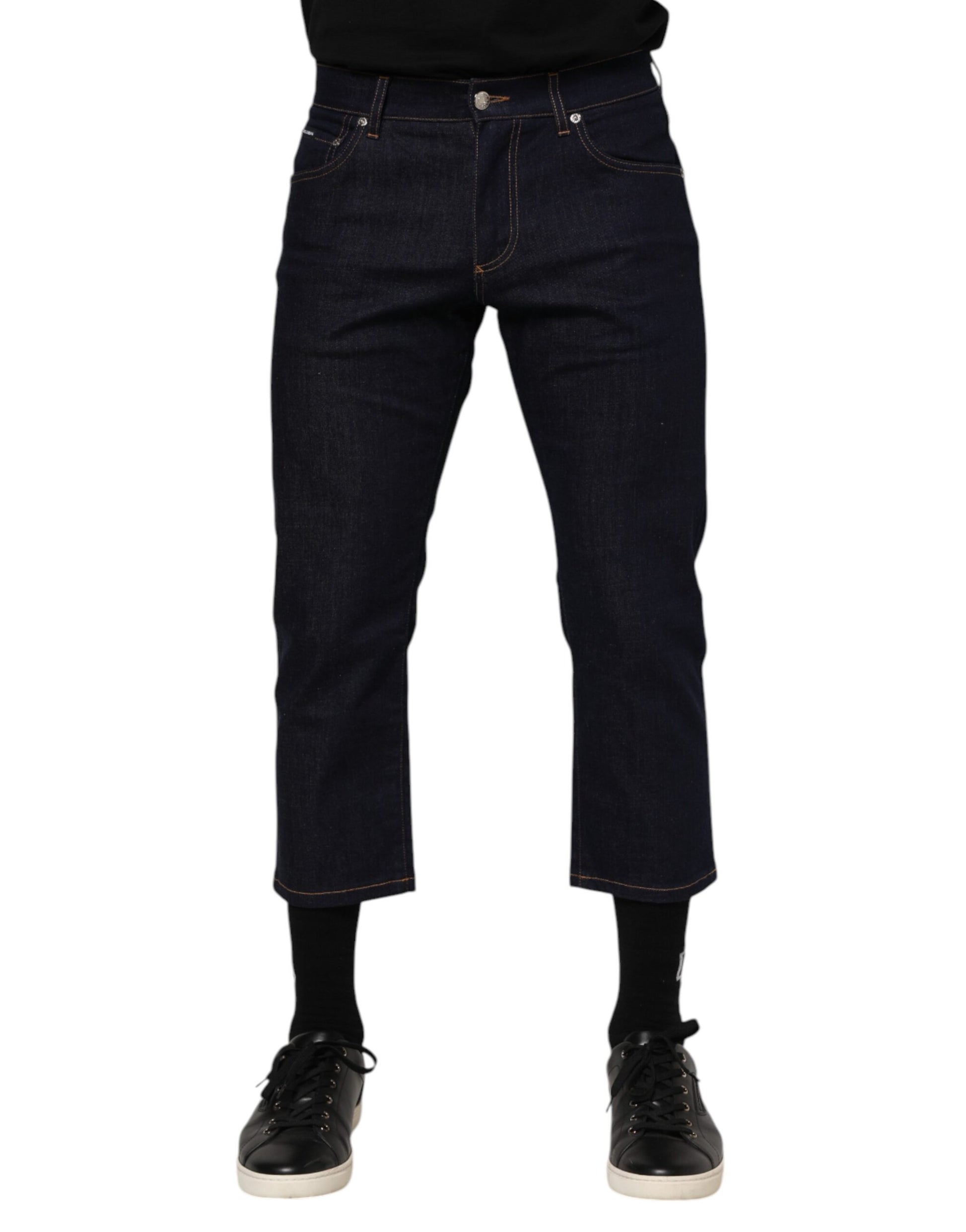 Pair of blue jeans with rolled up legs