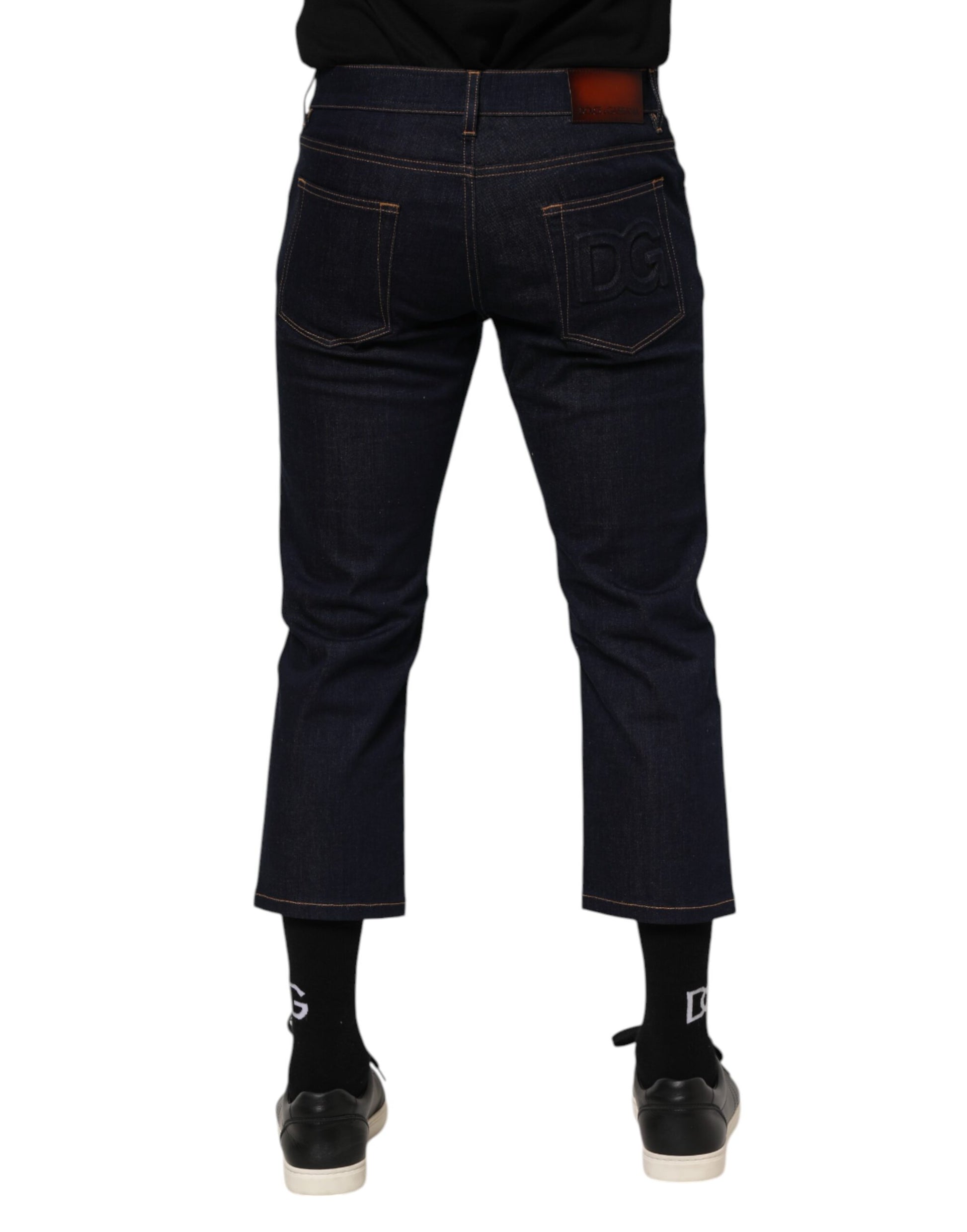 Pair of blue jeans with rolled up legs