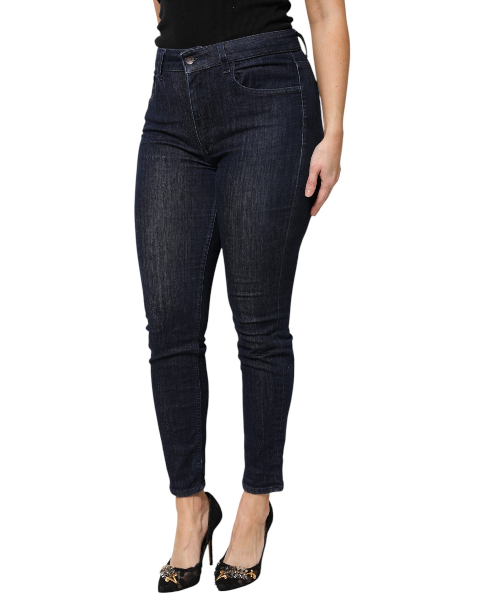 Woman wearing blue jeans and black heels