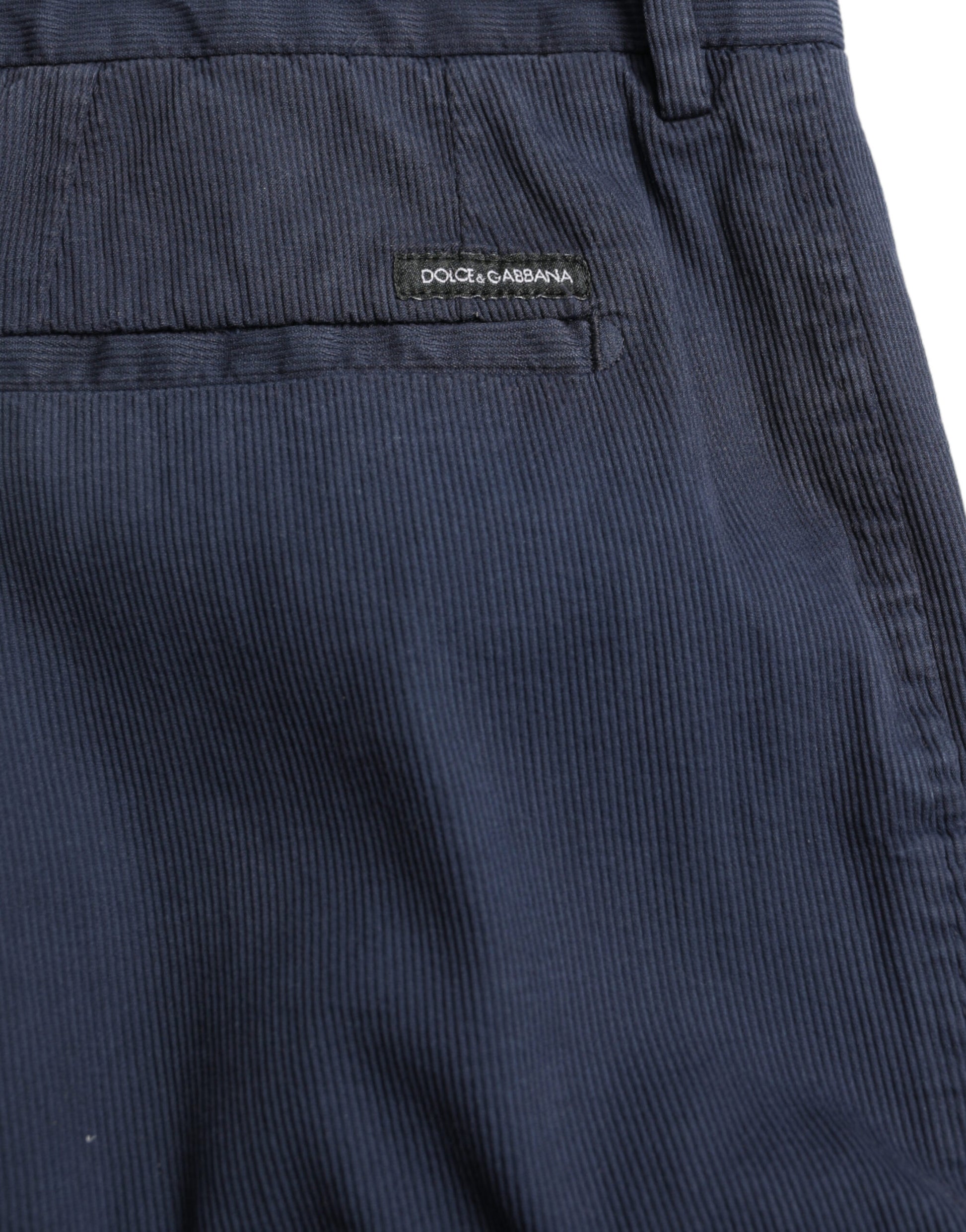 Navy blue pants with a label on the waistband