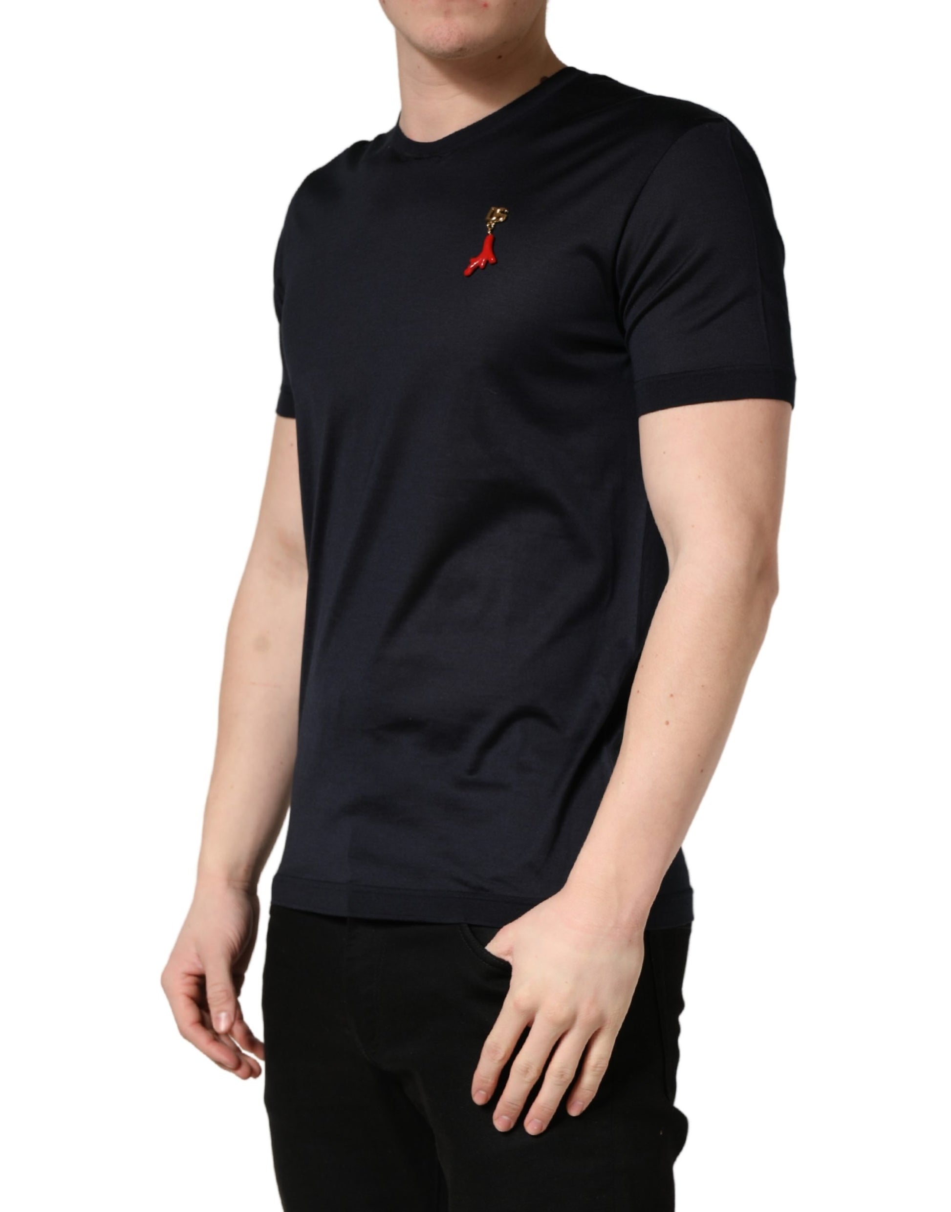 Man wearing dark blue t-shirt with red ribbon design on front