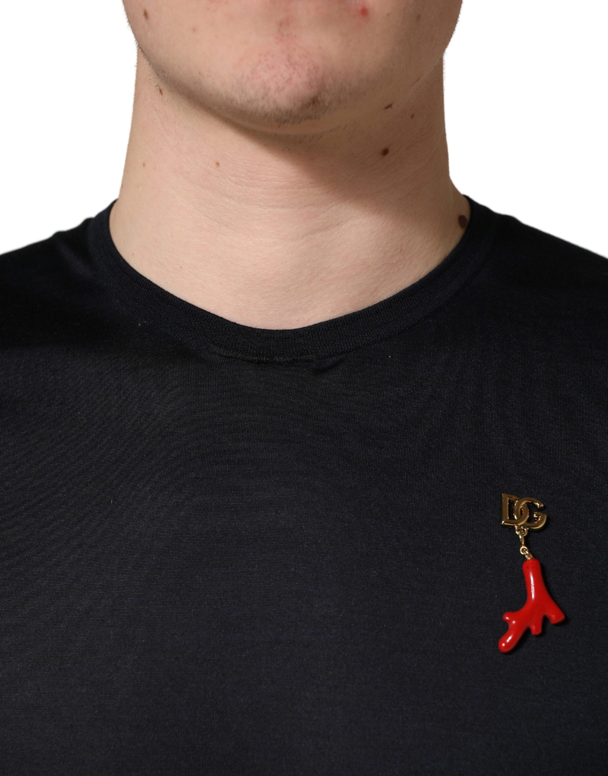 Red pin on black shirt