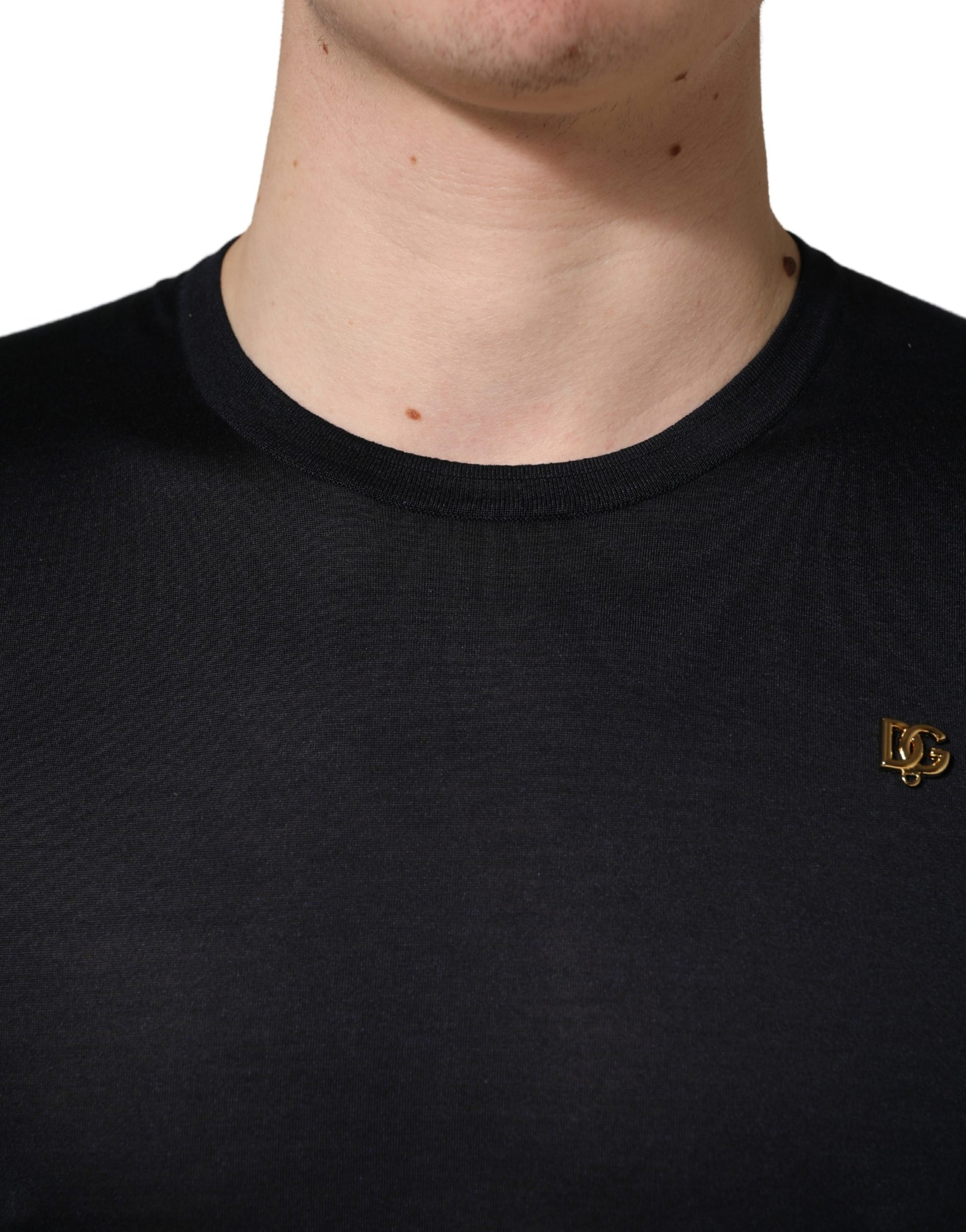 Black crew neck sweater with logo on left chest