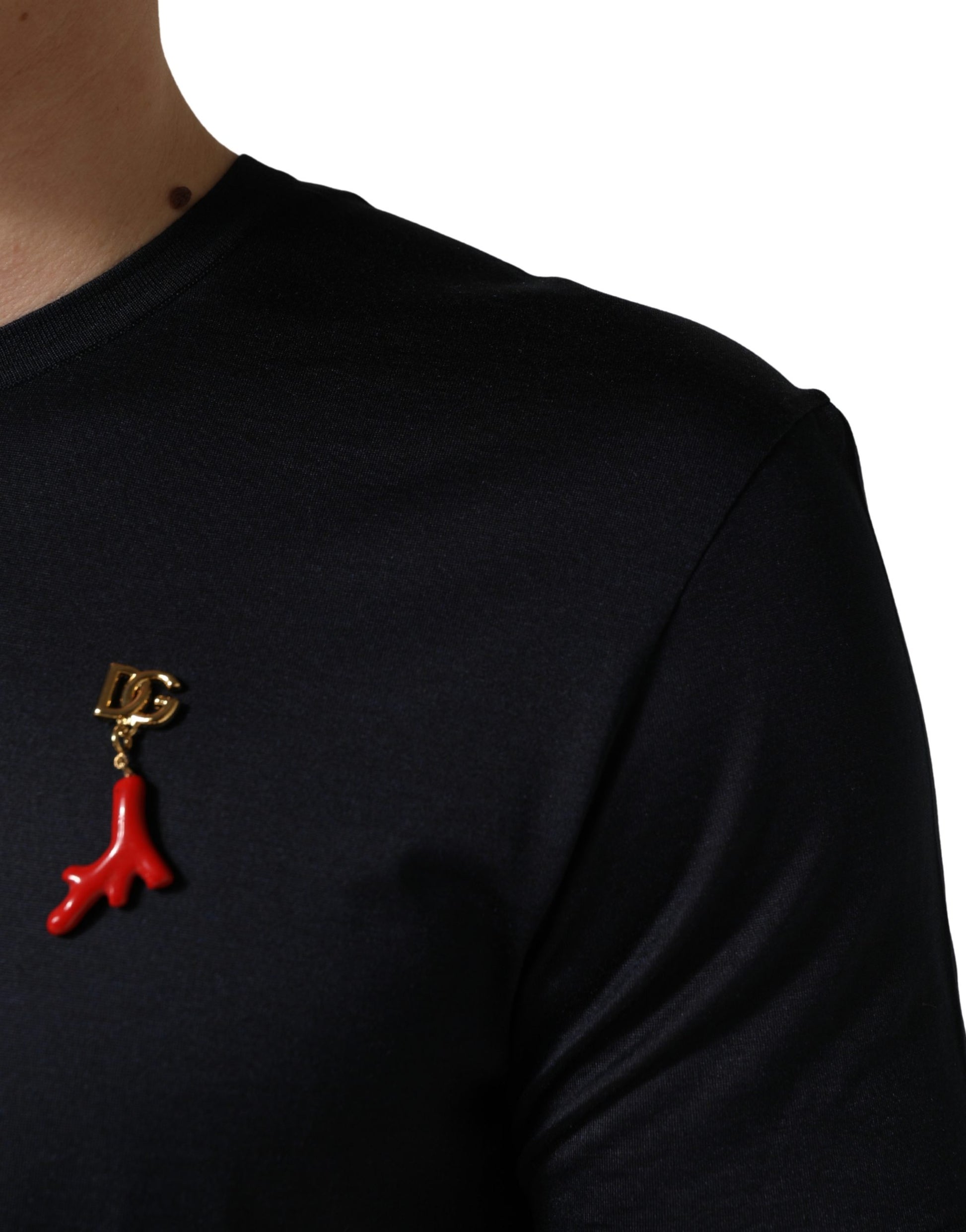 Red ribbon pin on black shirt