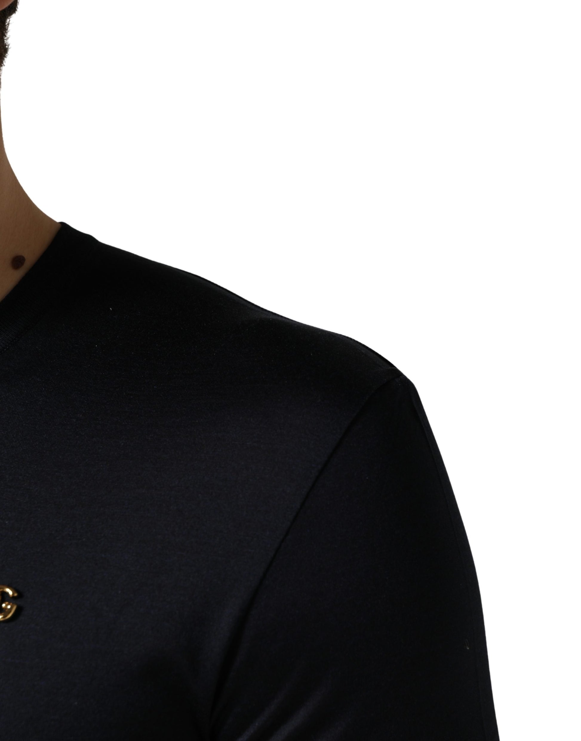 Black sleeveless shirt with a gold emblem on the left chest area