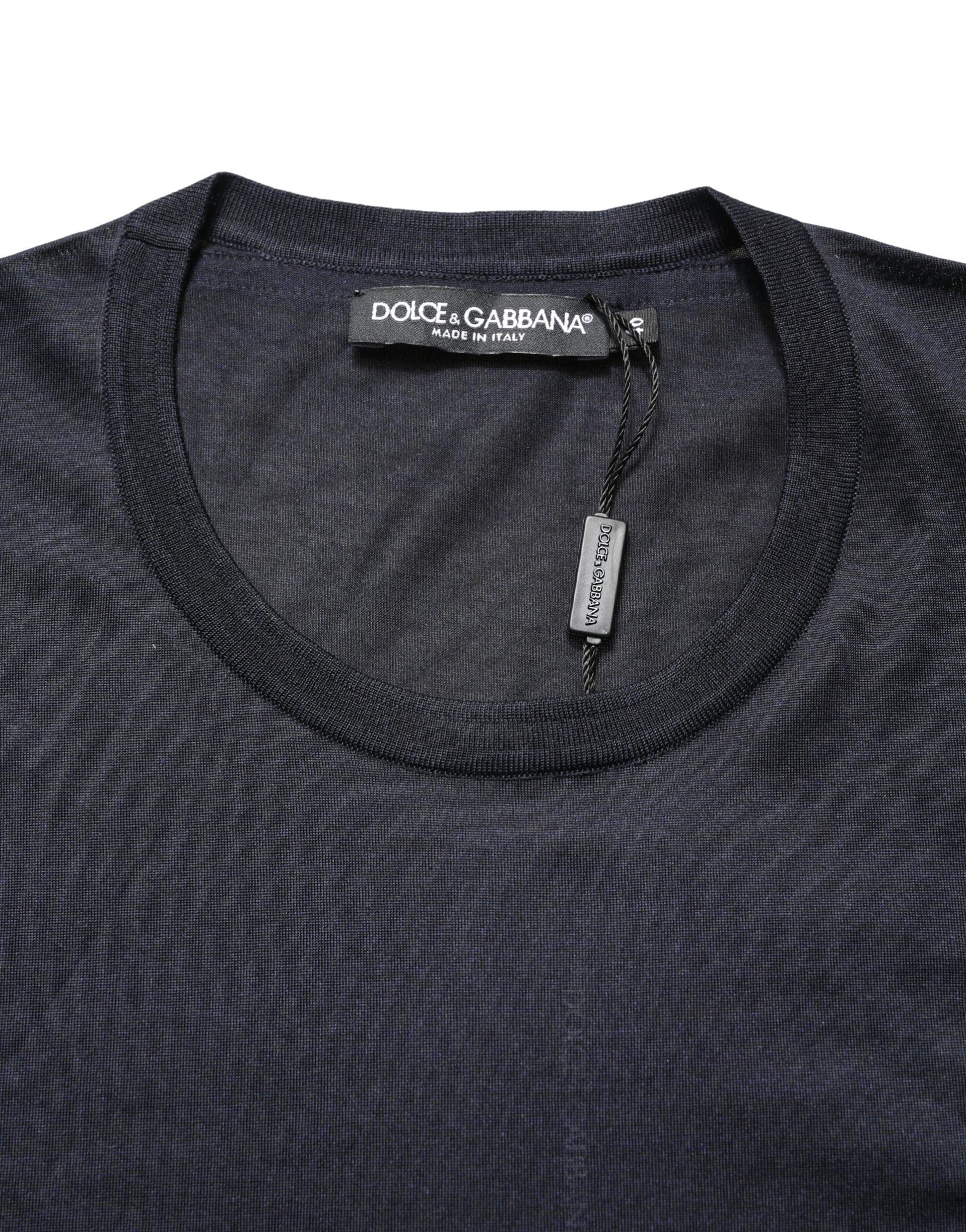Dark blue crew neck t-shirt with a tag on the collar