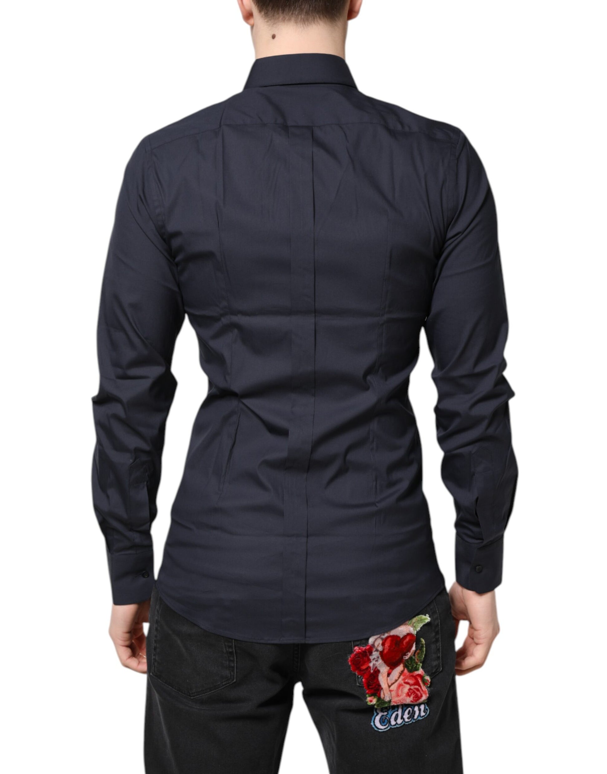 A dark blue dress shirt with gold accents, featuring a floral embroidery on the back