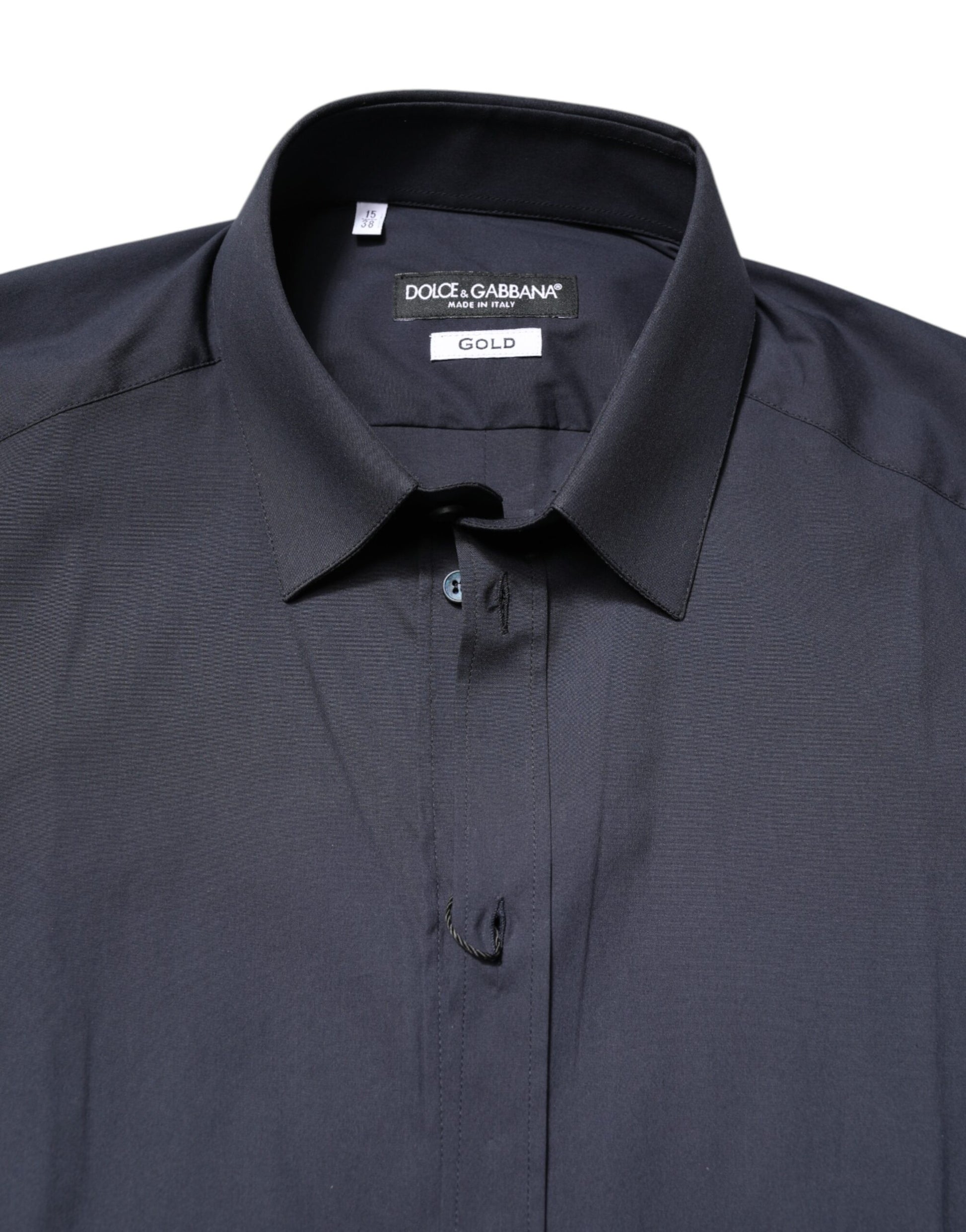 A dark blue dress shirt with a gold label from Dolce & Gabbana