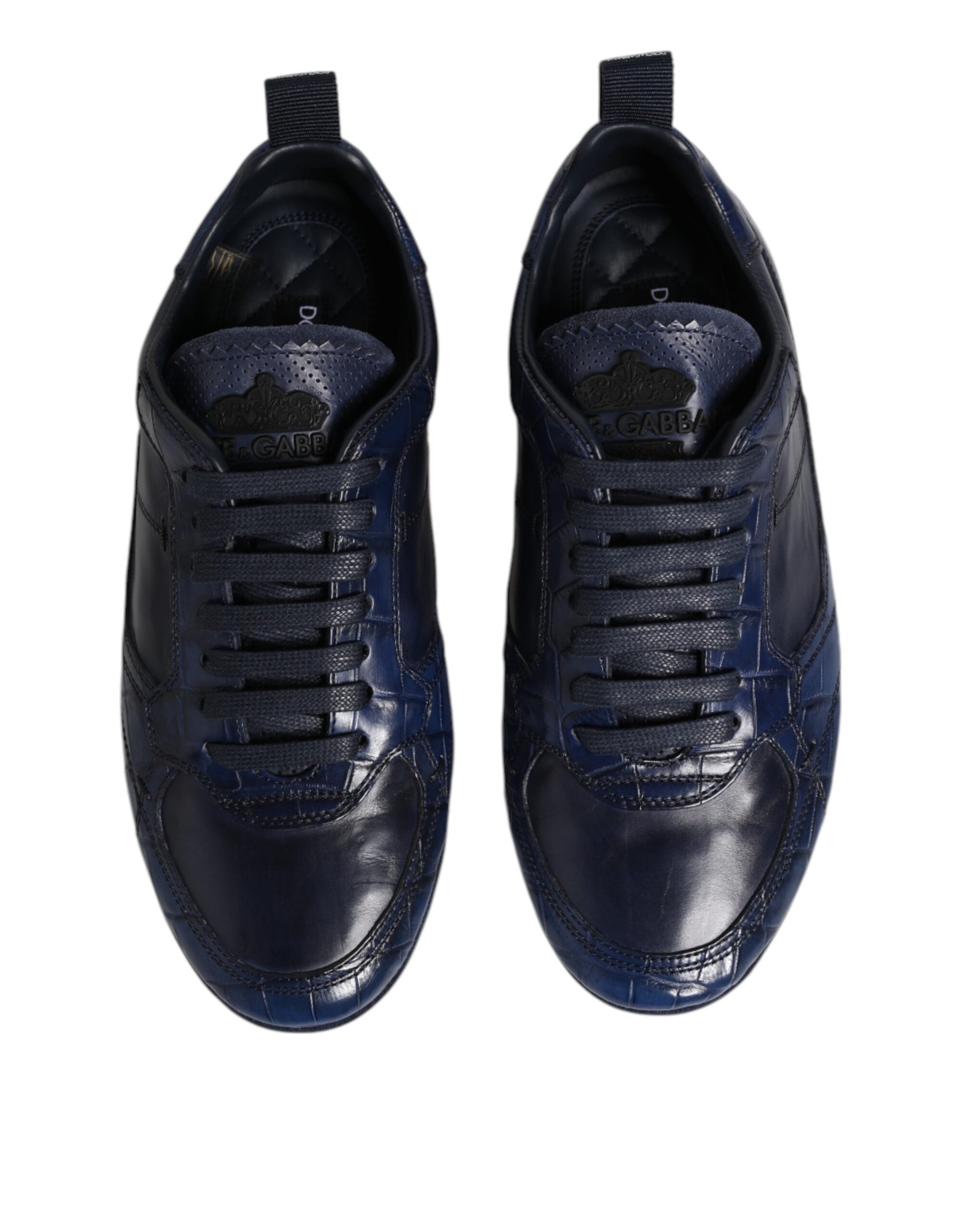 Pair of black sneakers with white laces