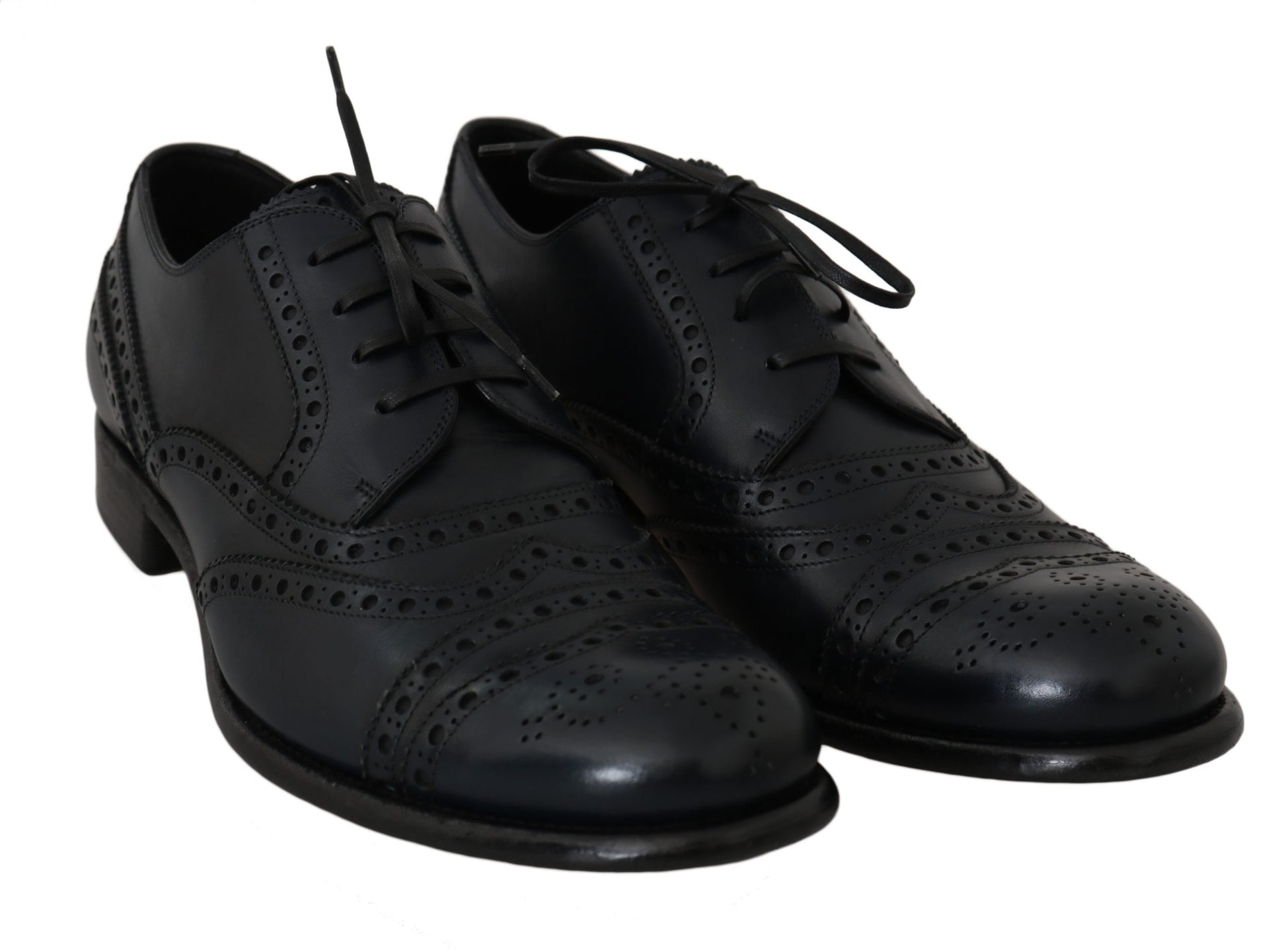 Pair of black leather shoes with laces and perforations