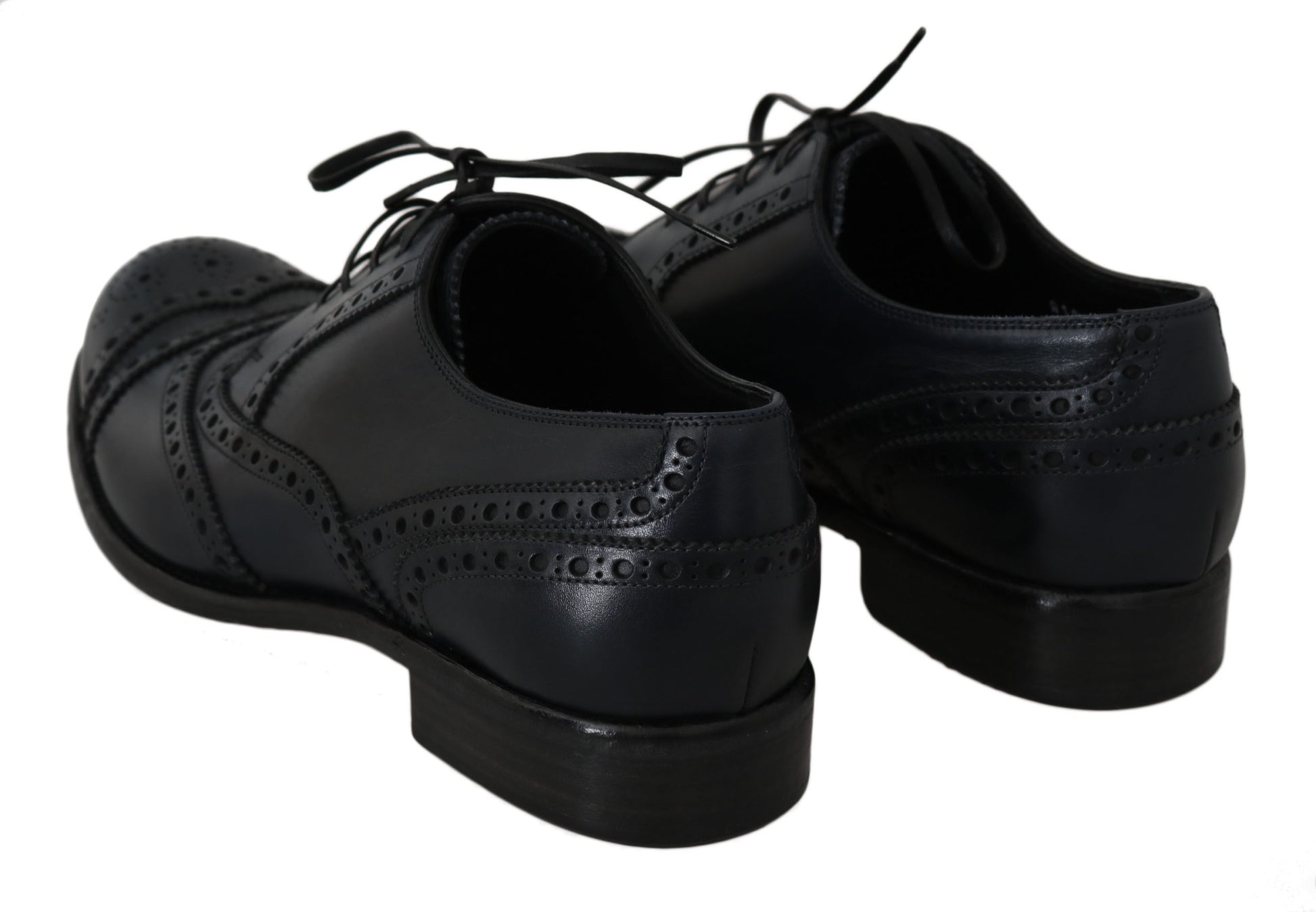 Pair of black dress shoes with laces and a bow tie design on top