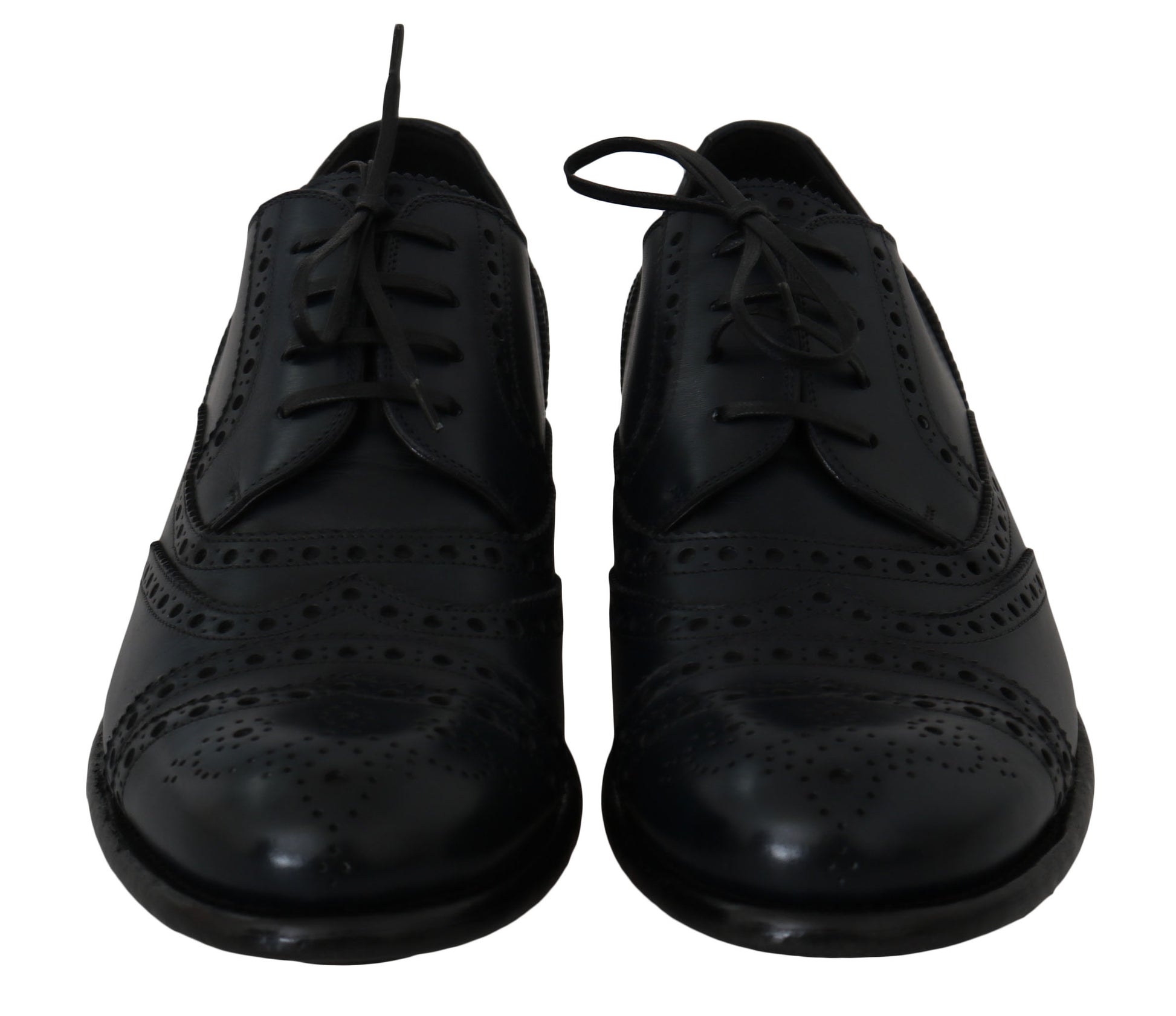 Pair of black dress shoes with laces and a bow tie