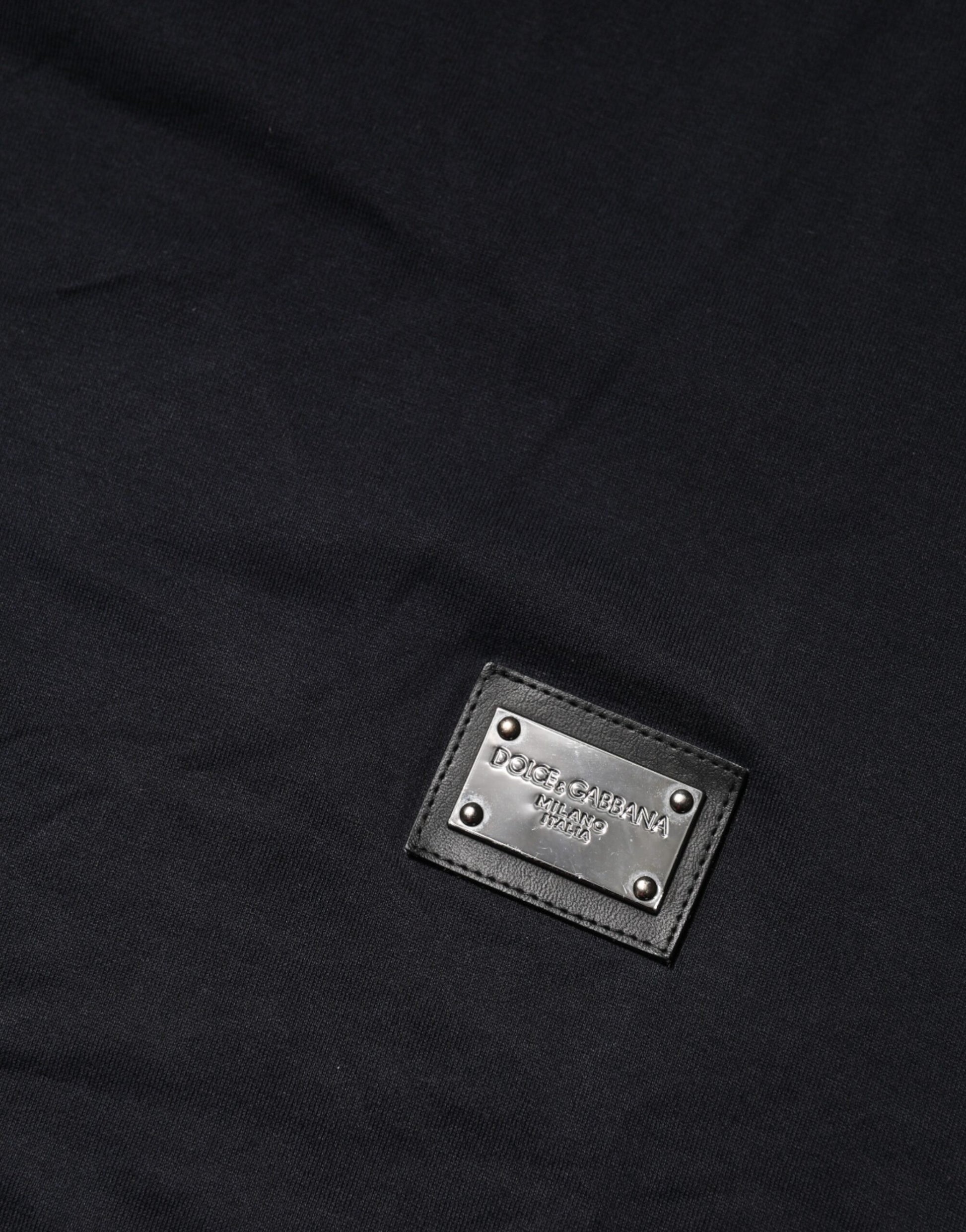 Black fabric with a small rectangular tag attached to it