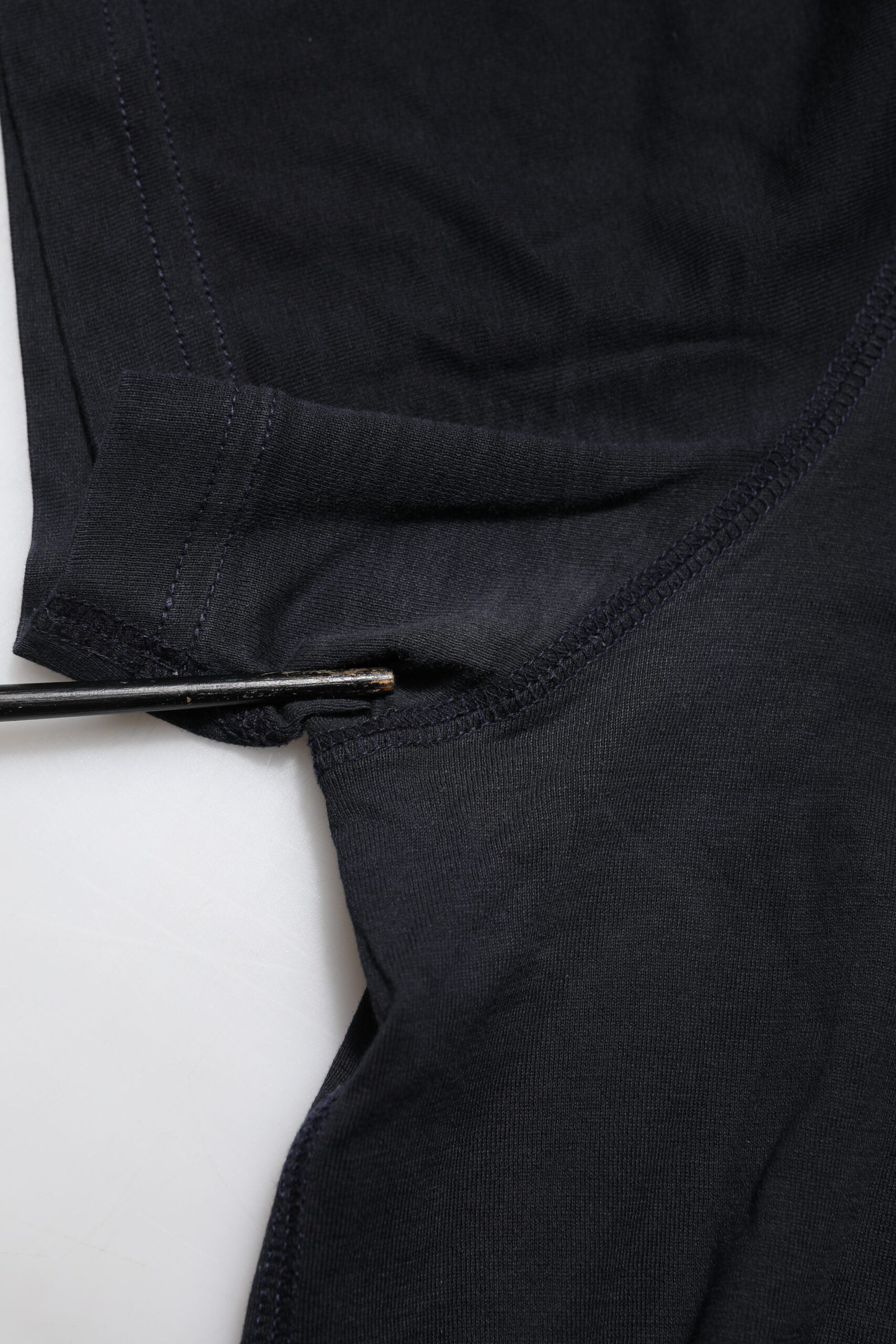 Black knitted sweater with ribbed cuffs