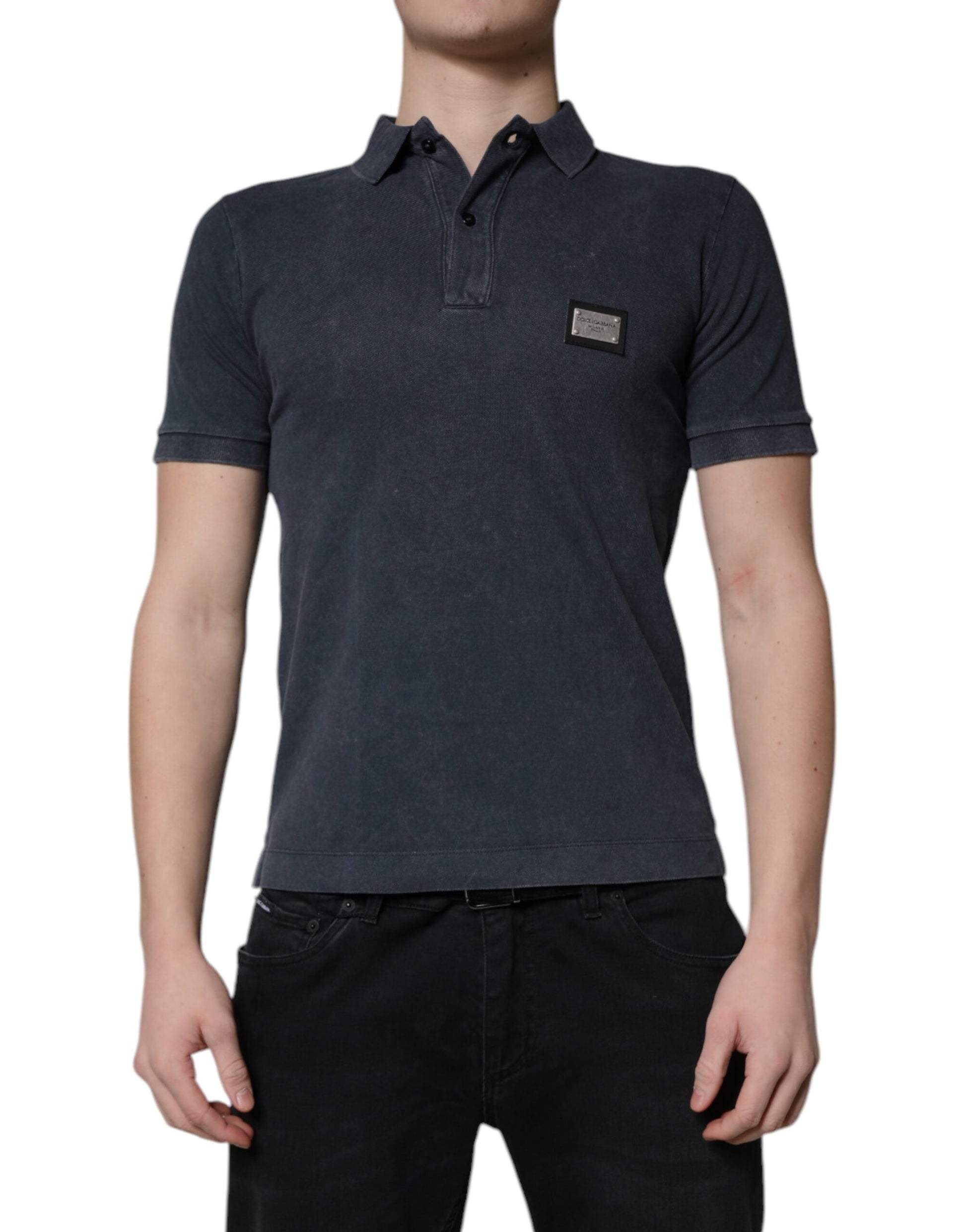 Man wearing dark blue polo shirt with small logo on left chest