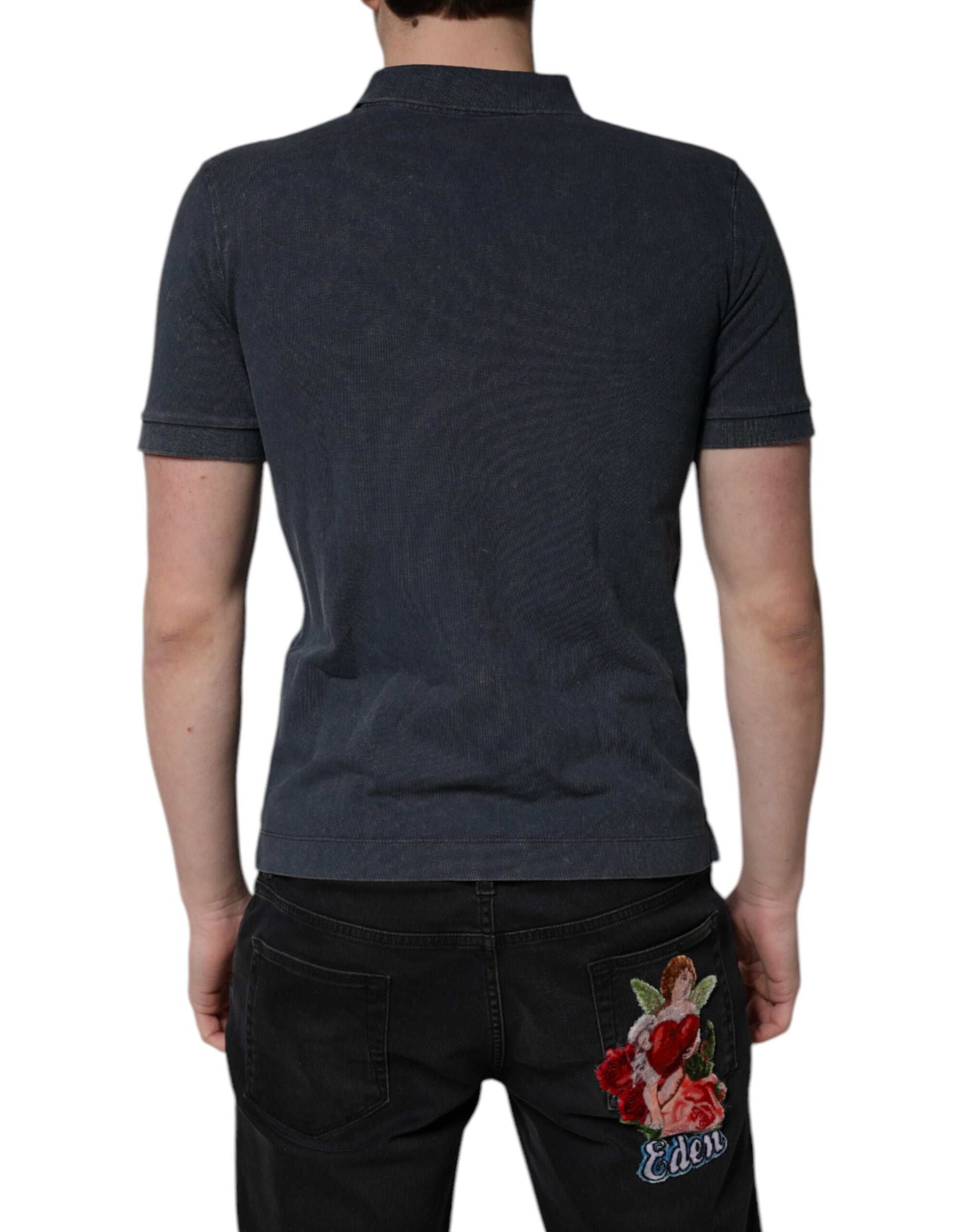 Man wearing polo shirt and jeans with floral design on back