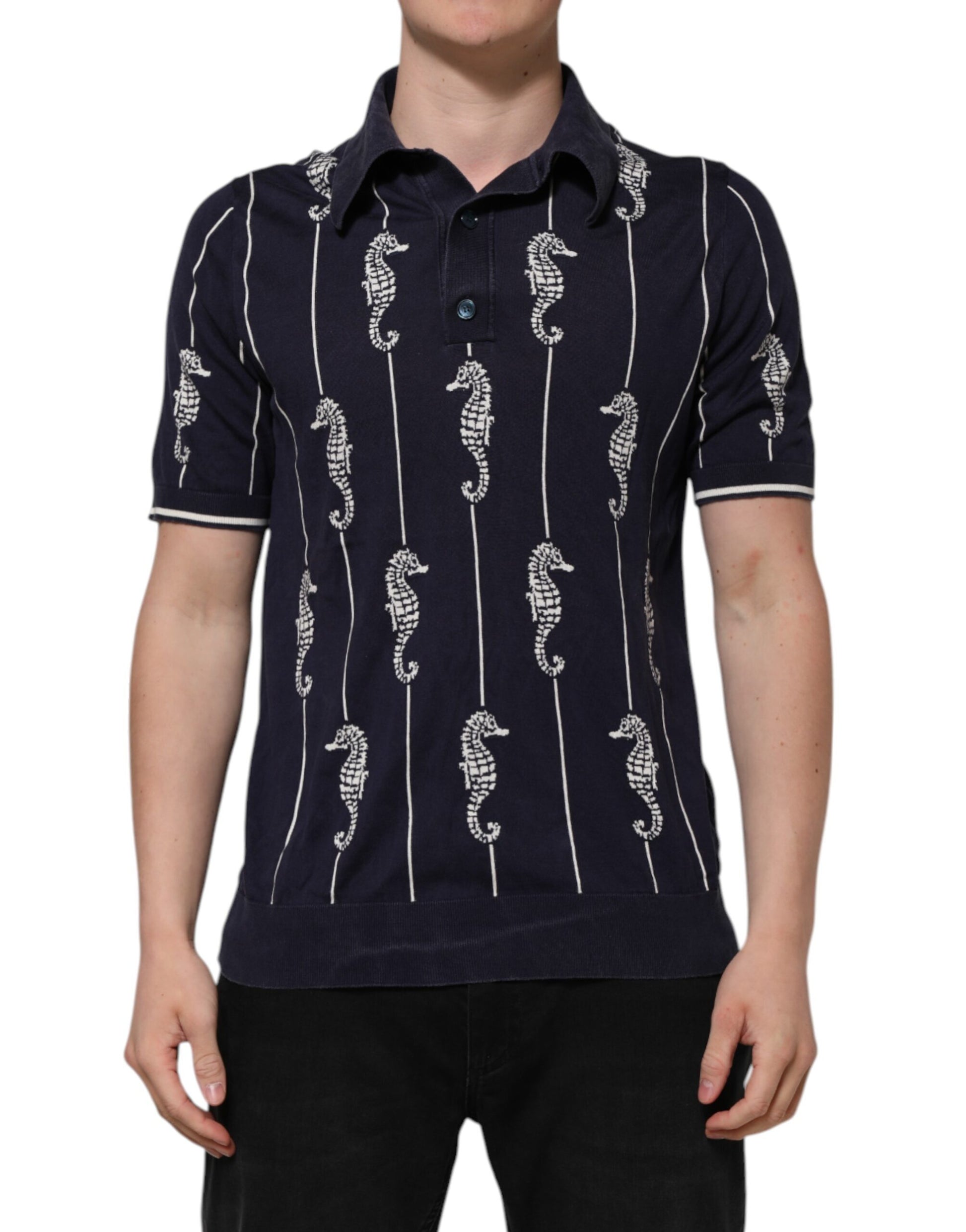 Man wearing a blue polo shirt with white seahorses on it