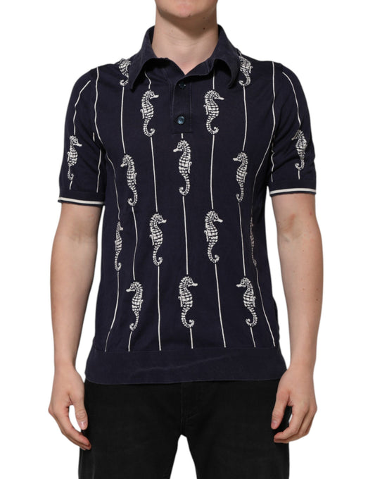 Man wearing a blue polo shirt with white seahorses on it