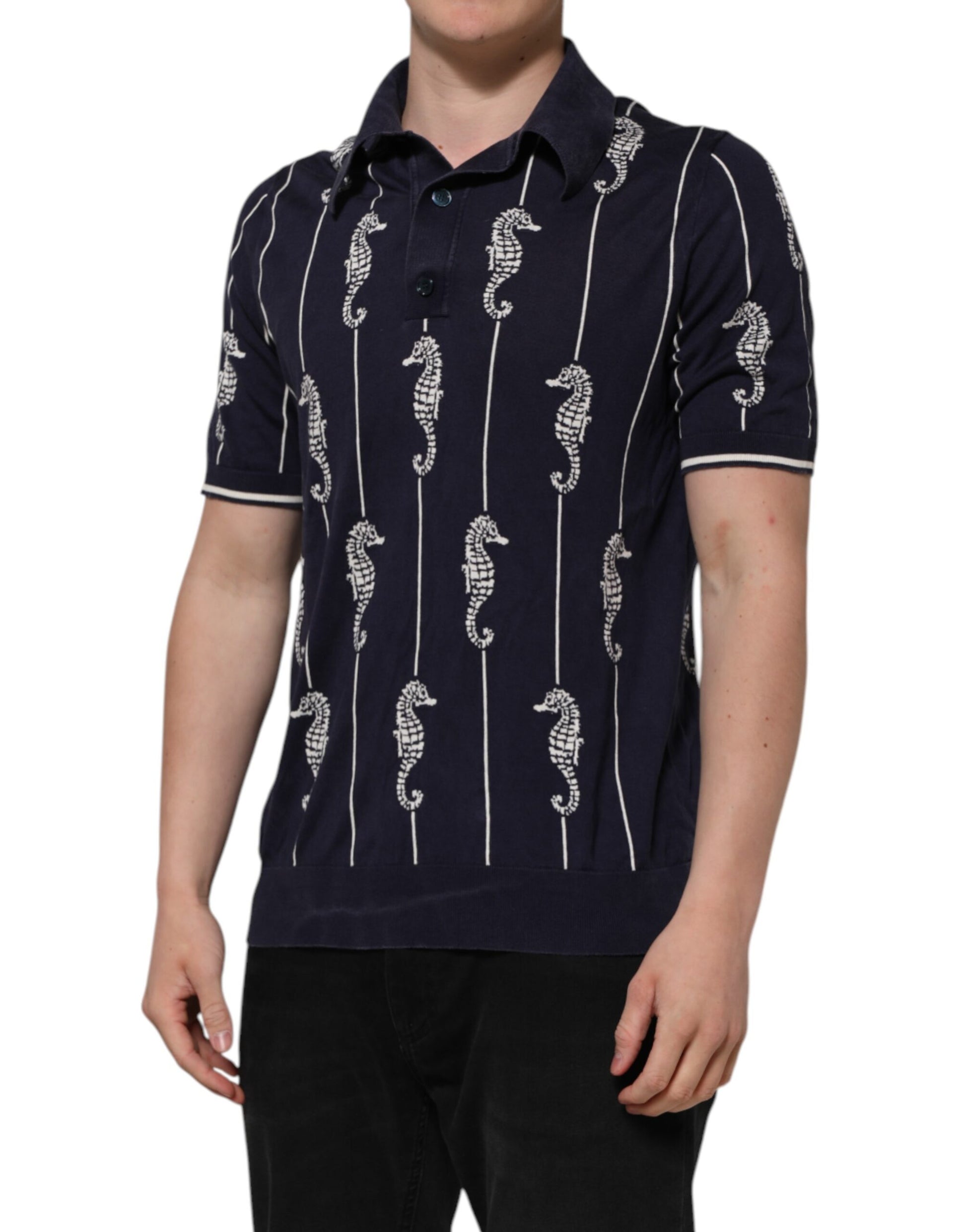 Man wearing a blue shirt with white seahorses on it