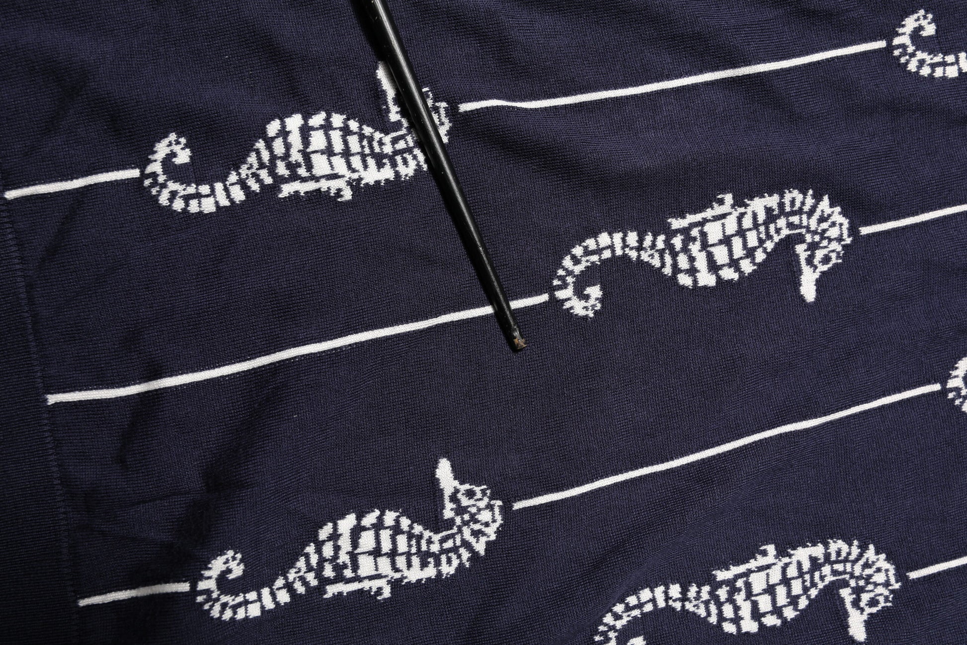 Hand embroidered blue towel with white cat design