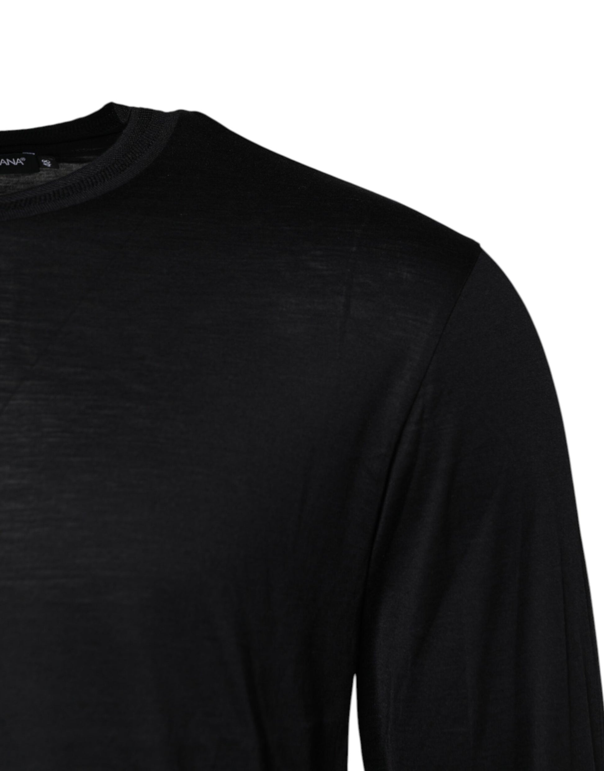 Black long sleeve shirt on hanger