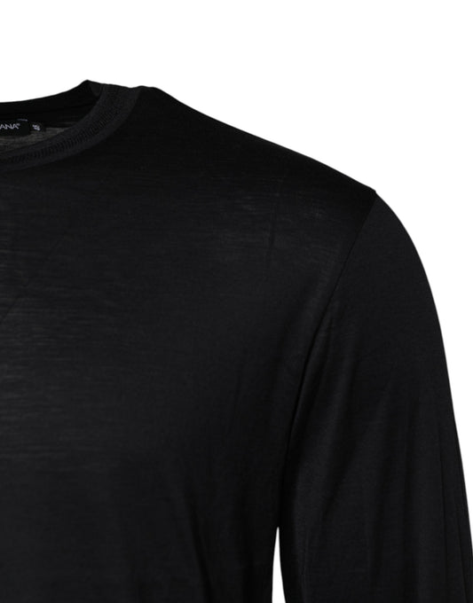 Black long sleeve shirt on hanger