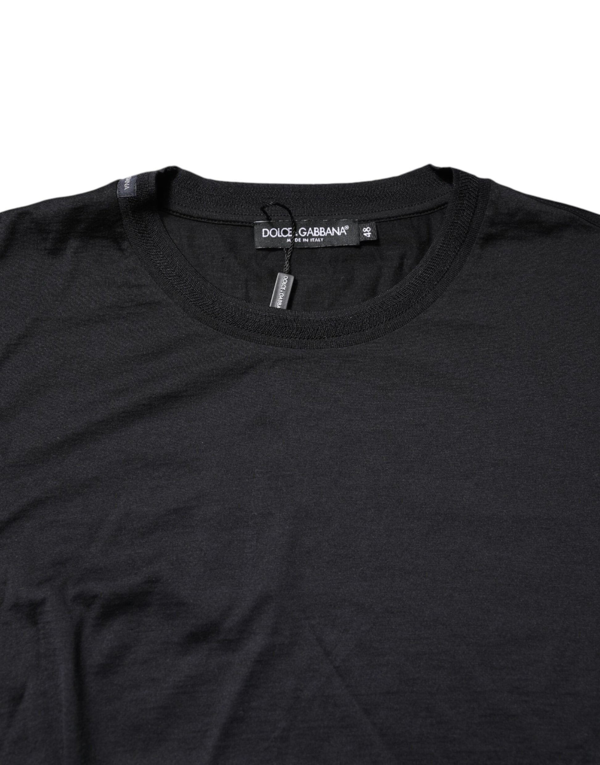 Black long sleeve shirt on hanger