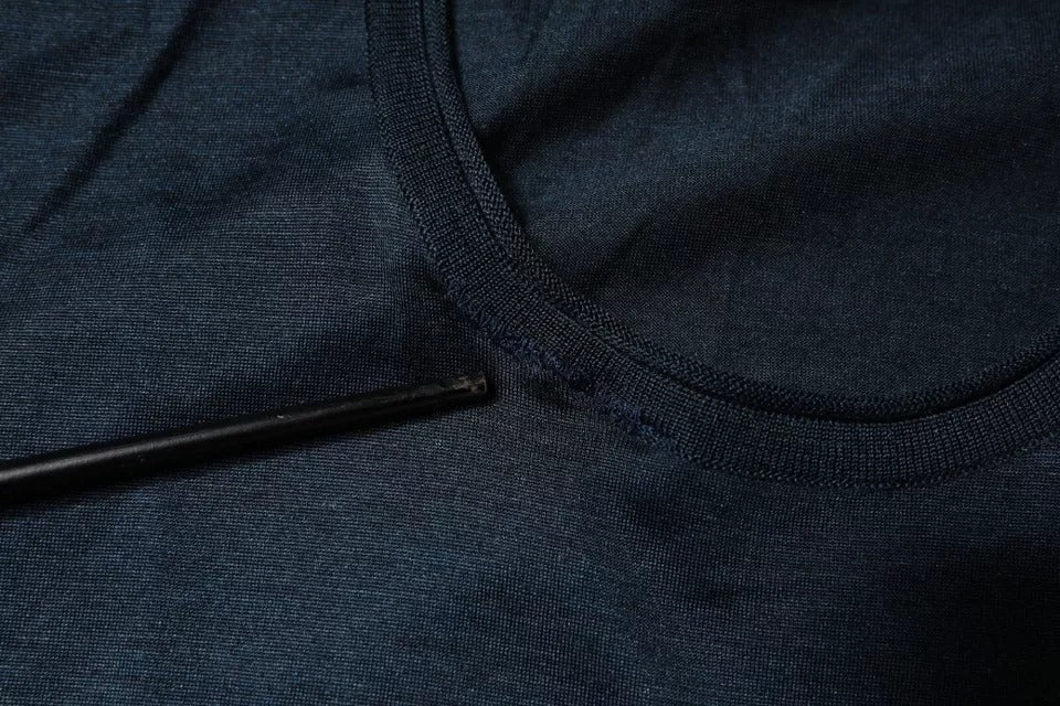 Blue denim jeans with a hole in the knee area