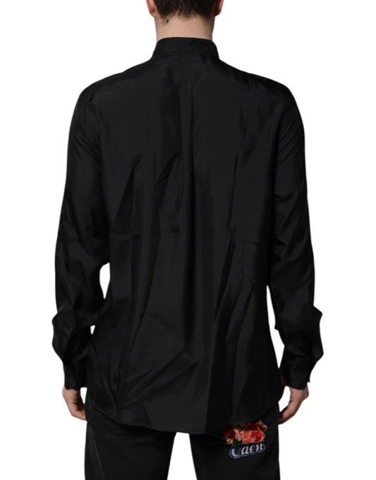 A dark blue silk men's formal dress shirt with a collar and long sleeves