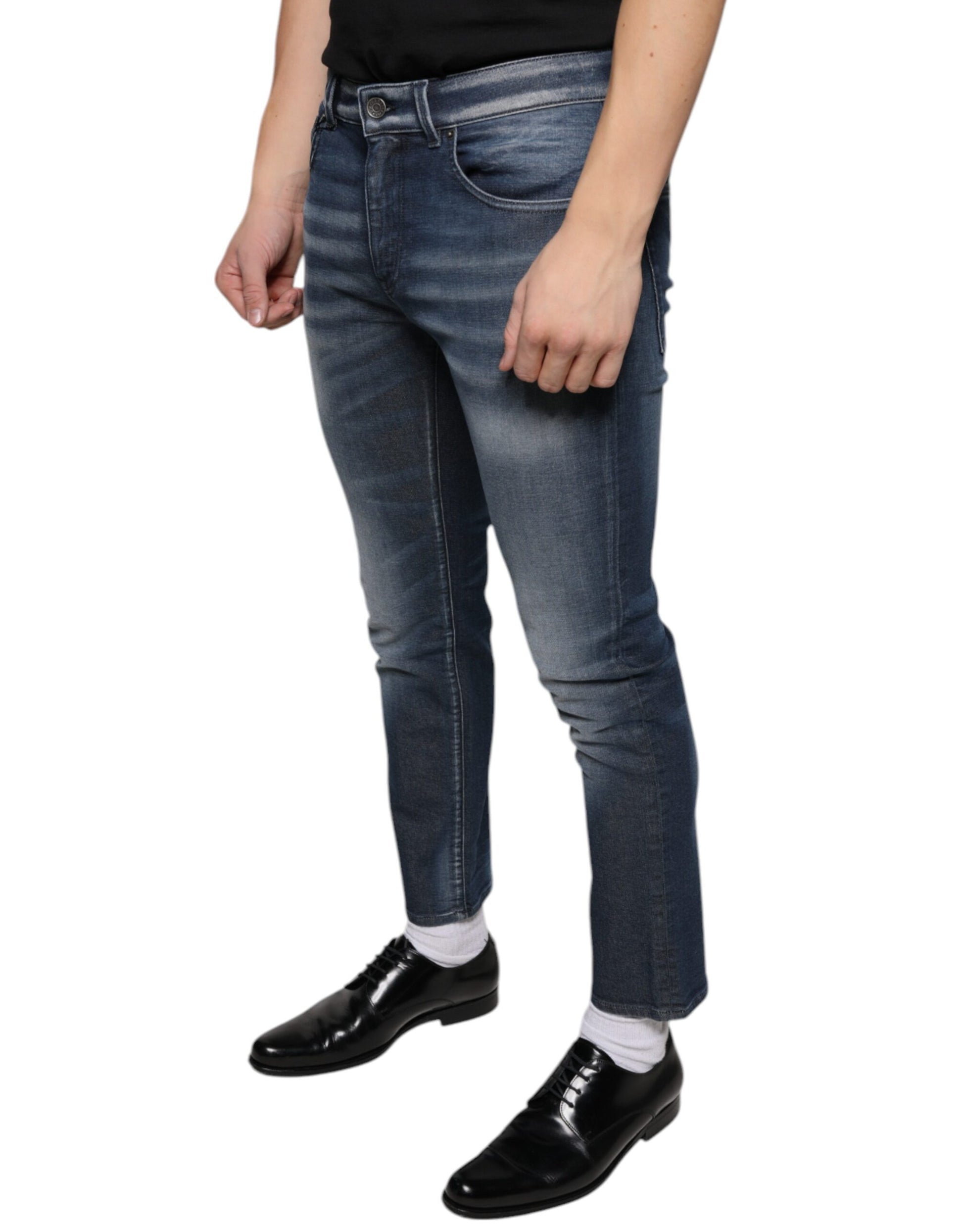 Man wearing blue jeans and black shoes