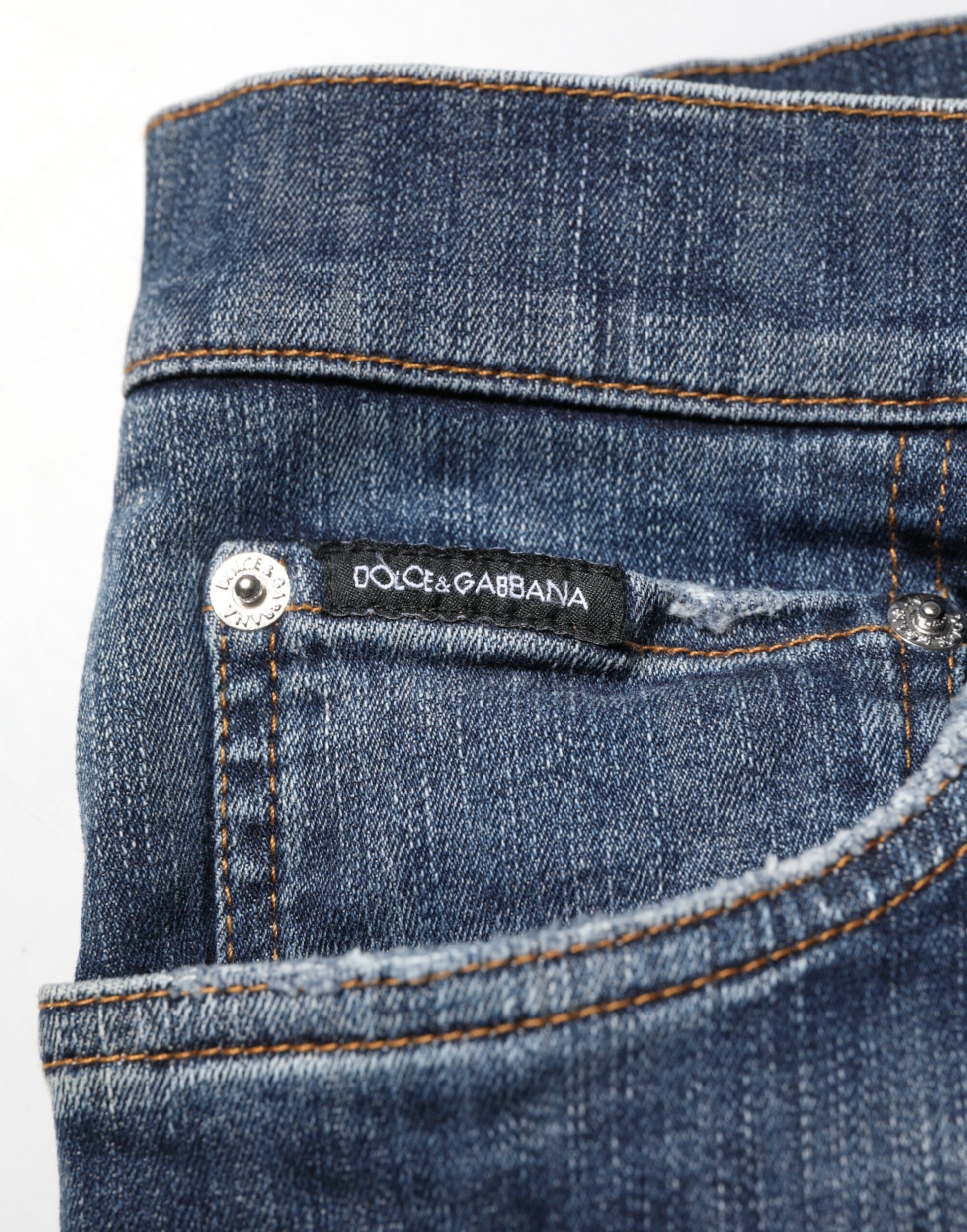 Blue denim jeans with brand label on pocket