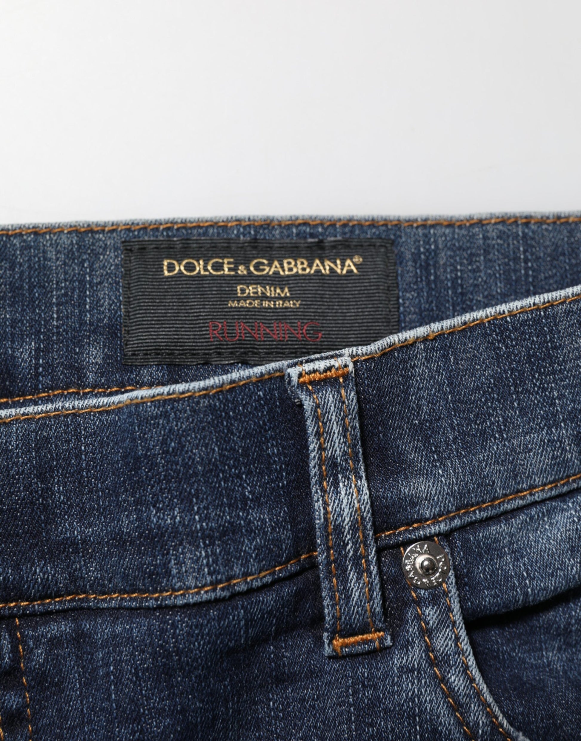 Blue denim jeans with brand label on waistband