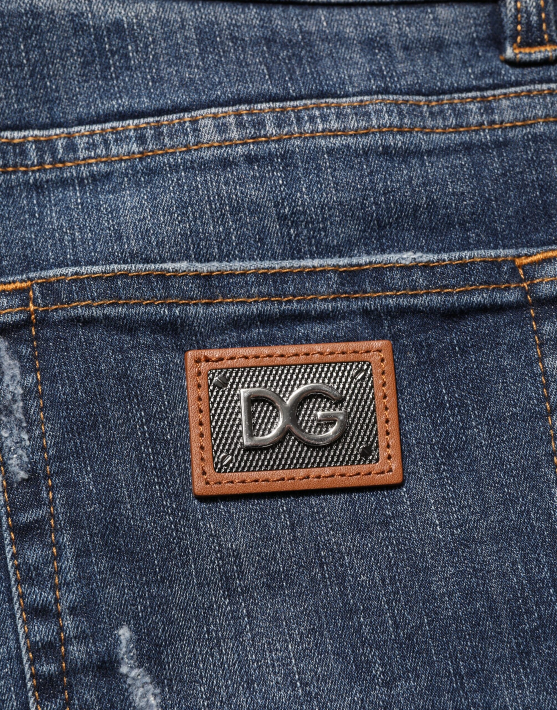 Blue denim jeans with brown leather patch on back pocket