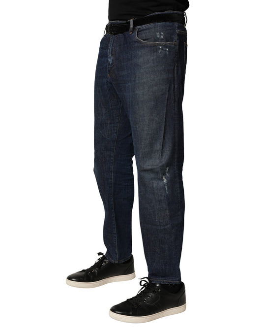 Man wearing blue jeans and black shoes