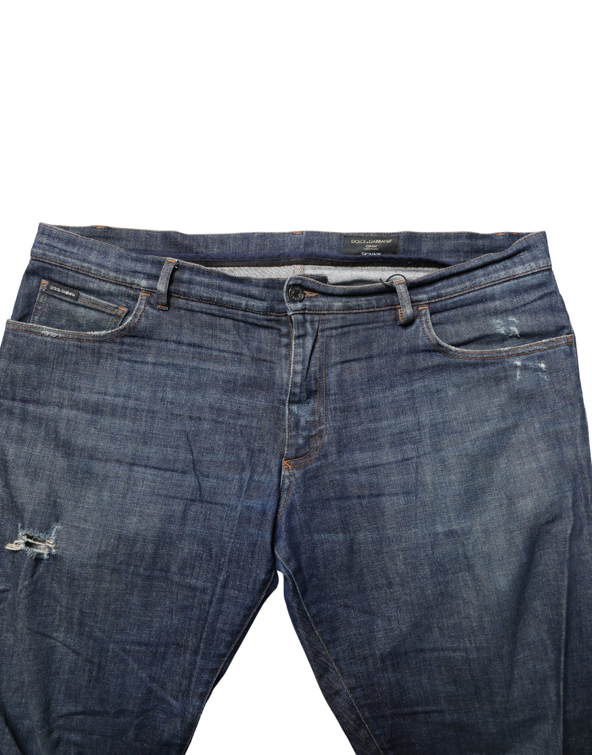 Pair of blue jeans with faded areas and stitched pockets