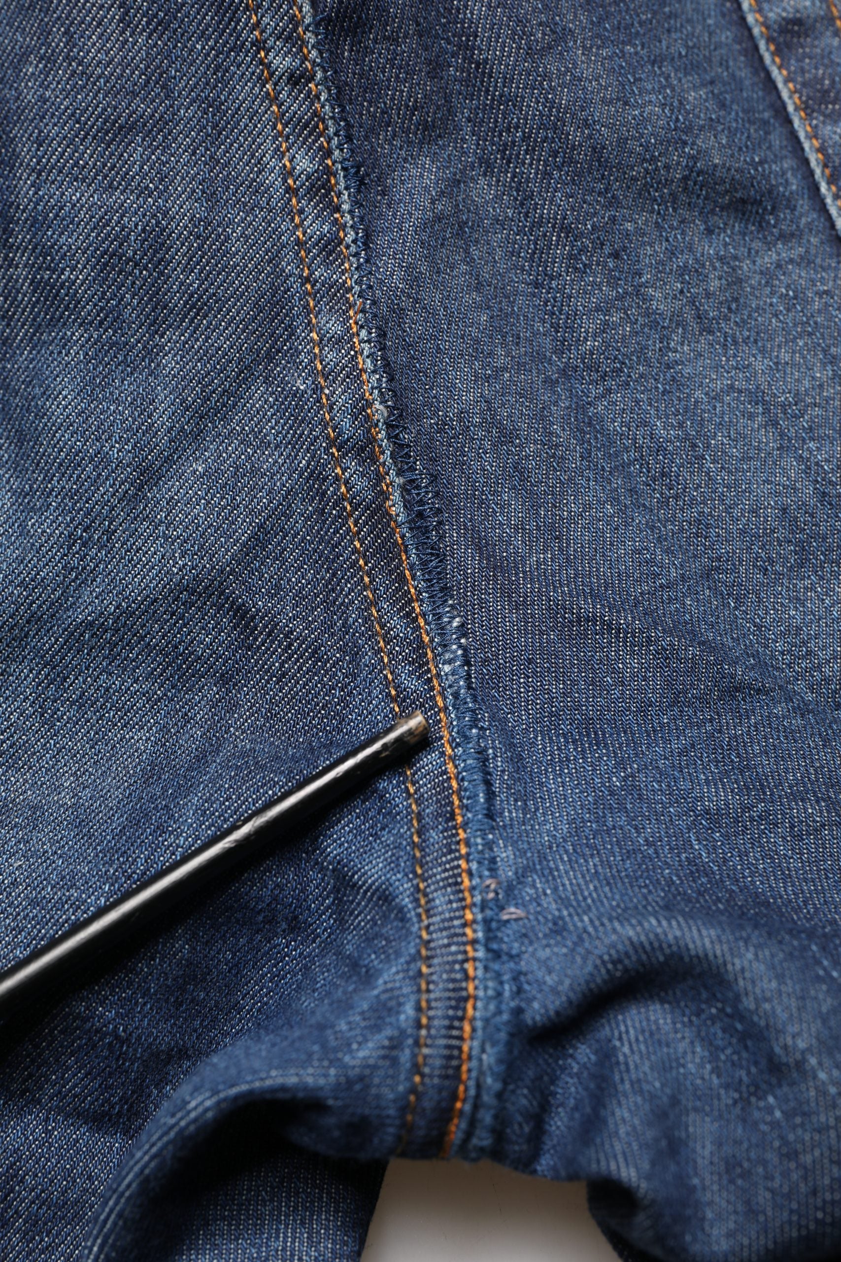 Blue denim jeans with stitched seams
