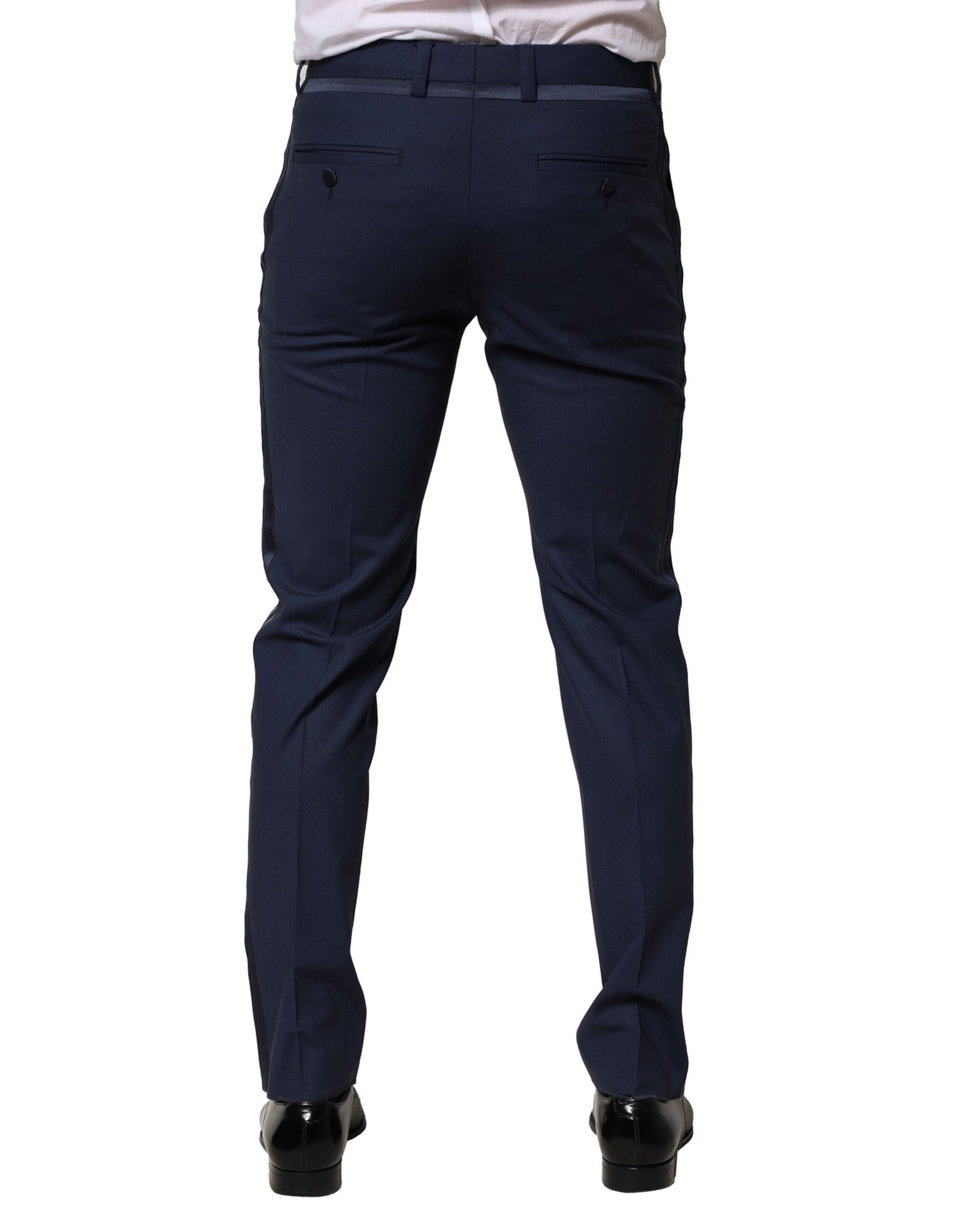 A pair of dark blue wool dress pants from Dolce & Gabbana, featuring a slim fit and visible brand logo