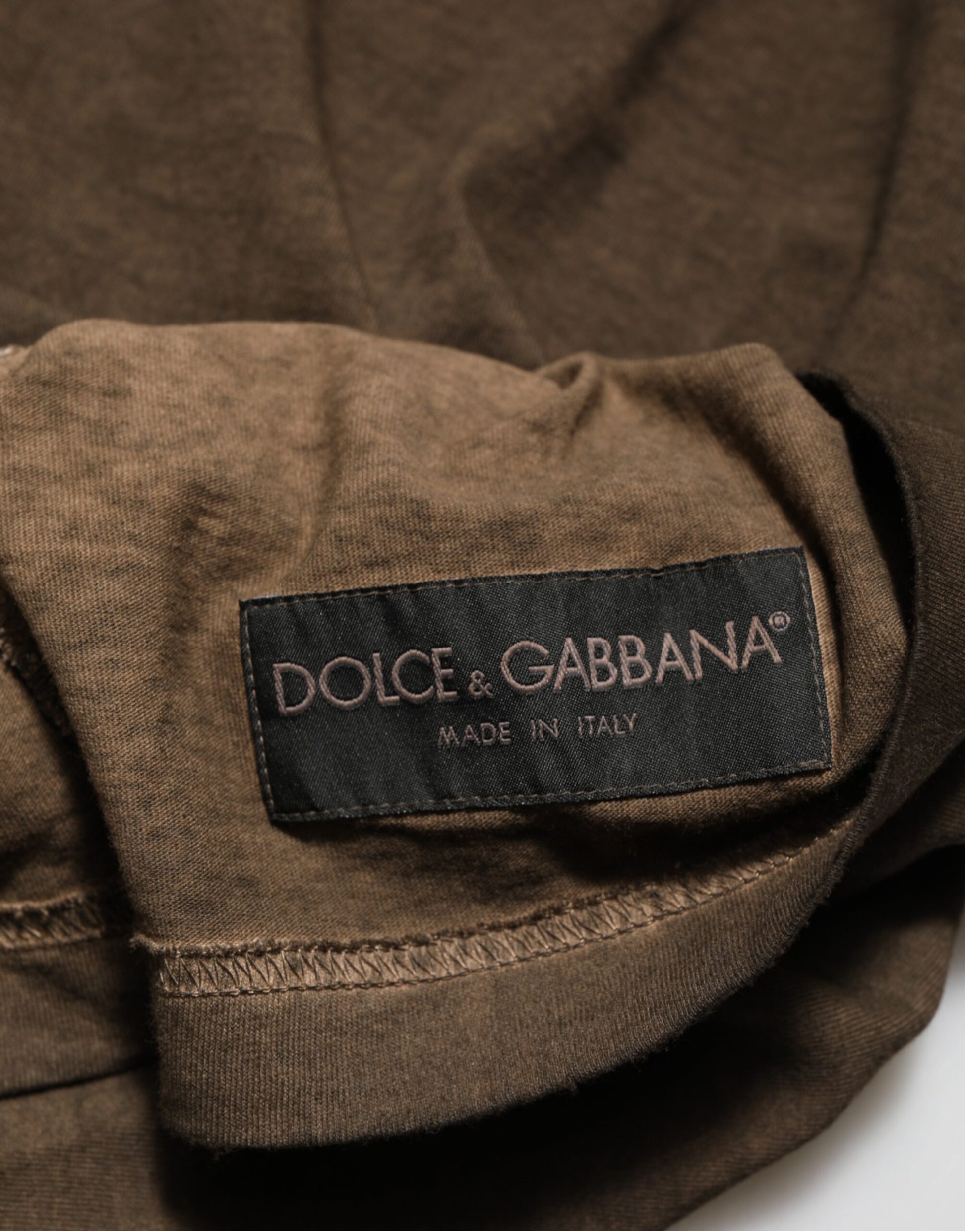 Brown cotton shirt with black label on sleeve
