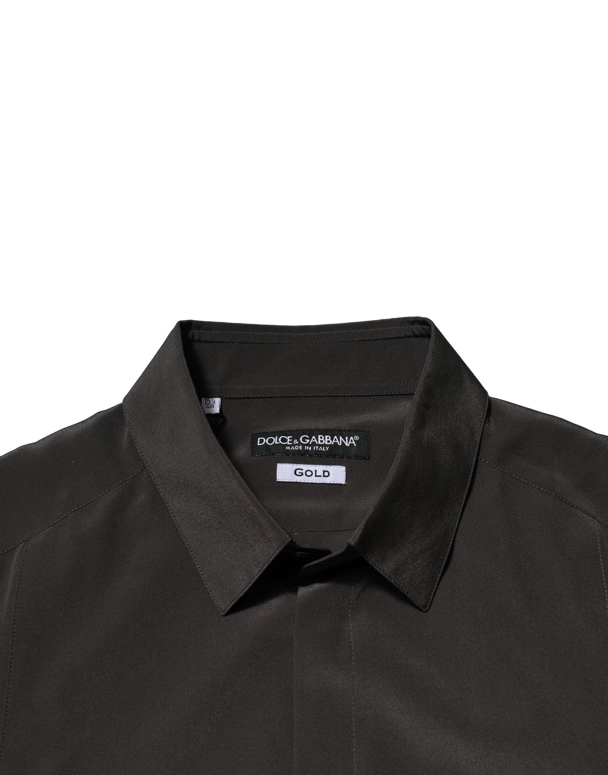 A dark brown silk dress shirt with a gold label from Dolce & Gabbana