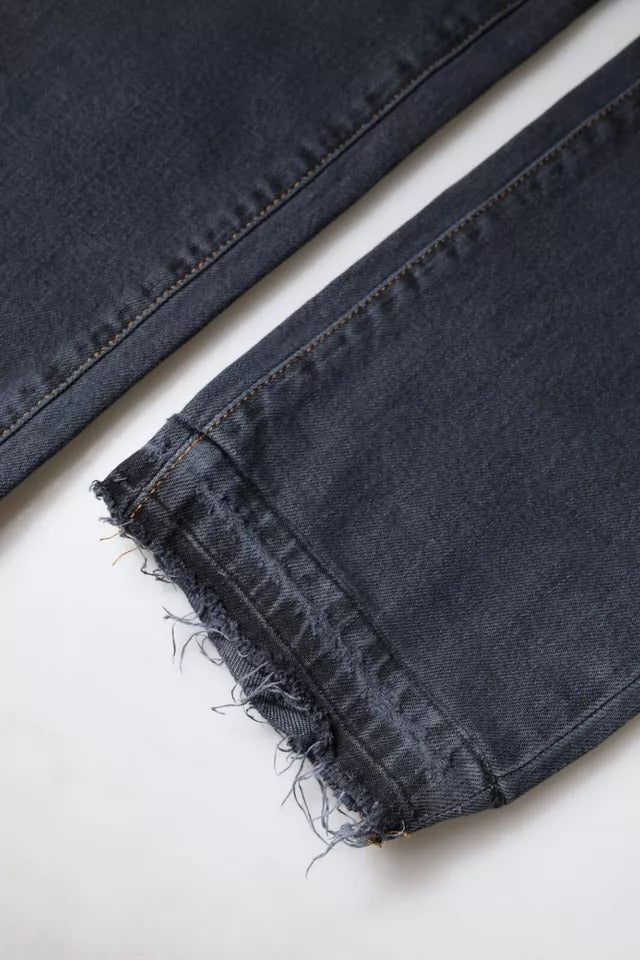 Pair of jeans with frayed hem