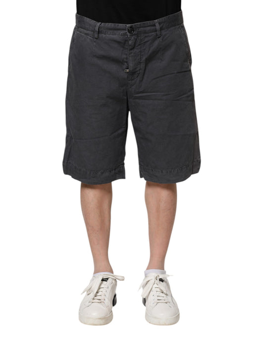Man wearing black shorts and white sneakers