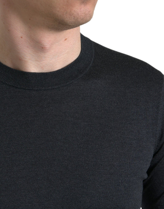 The man is wearing a dark colored sweater