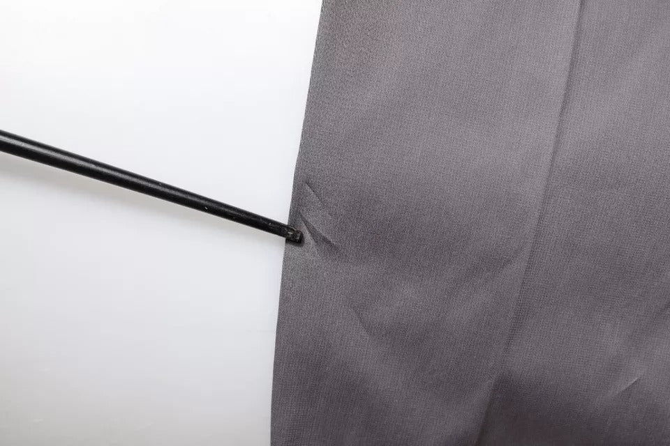 A pair of dark gray mid waist dress pants from Dolce & Gabbana