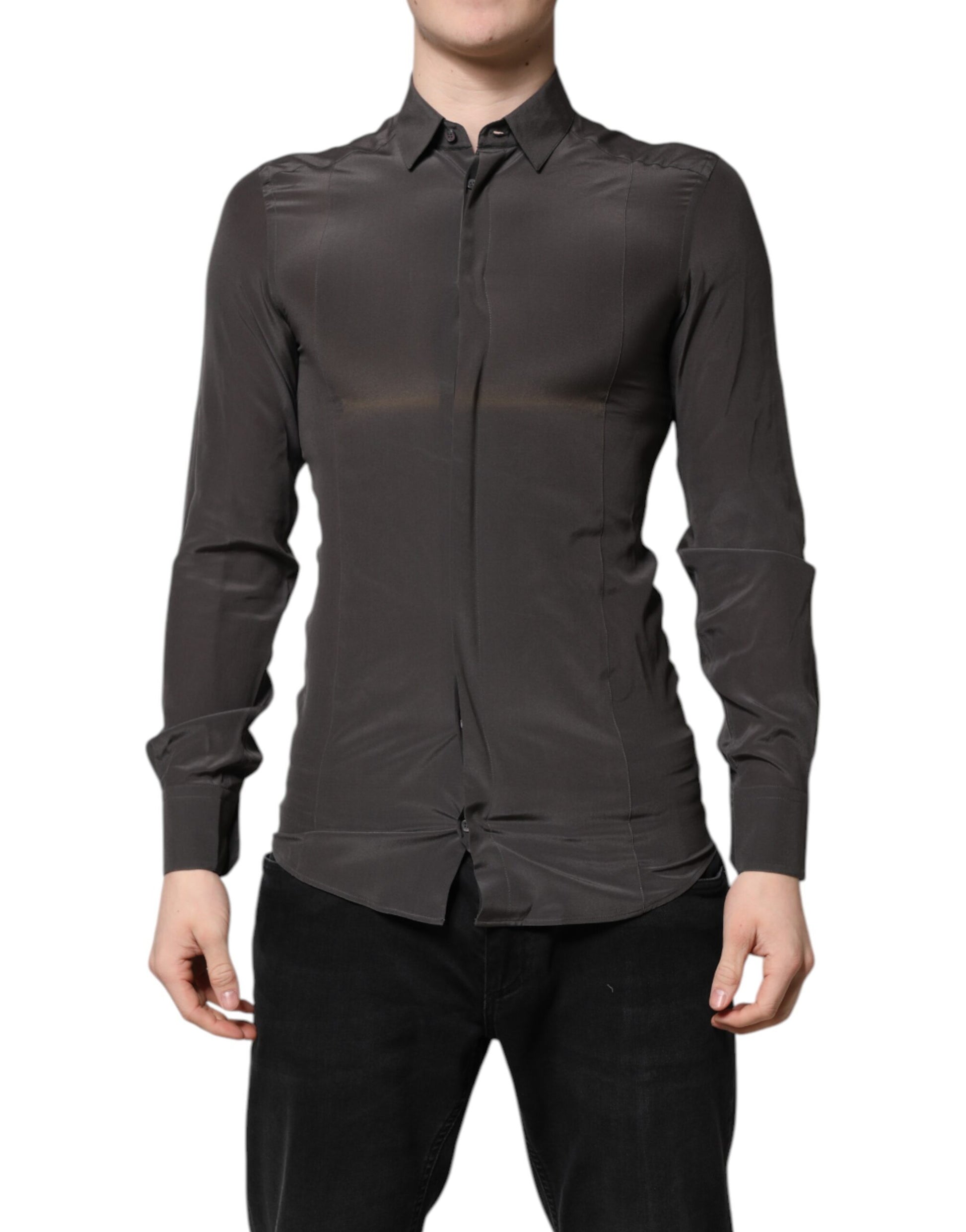 A mannequin wearing a dark gray silk shirt with gold accents. It is designed by Dolce & Gabbana and is part o