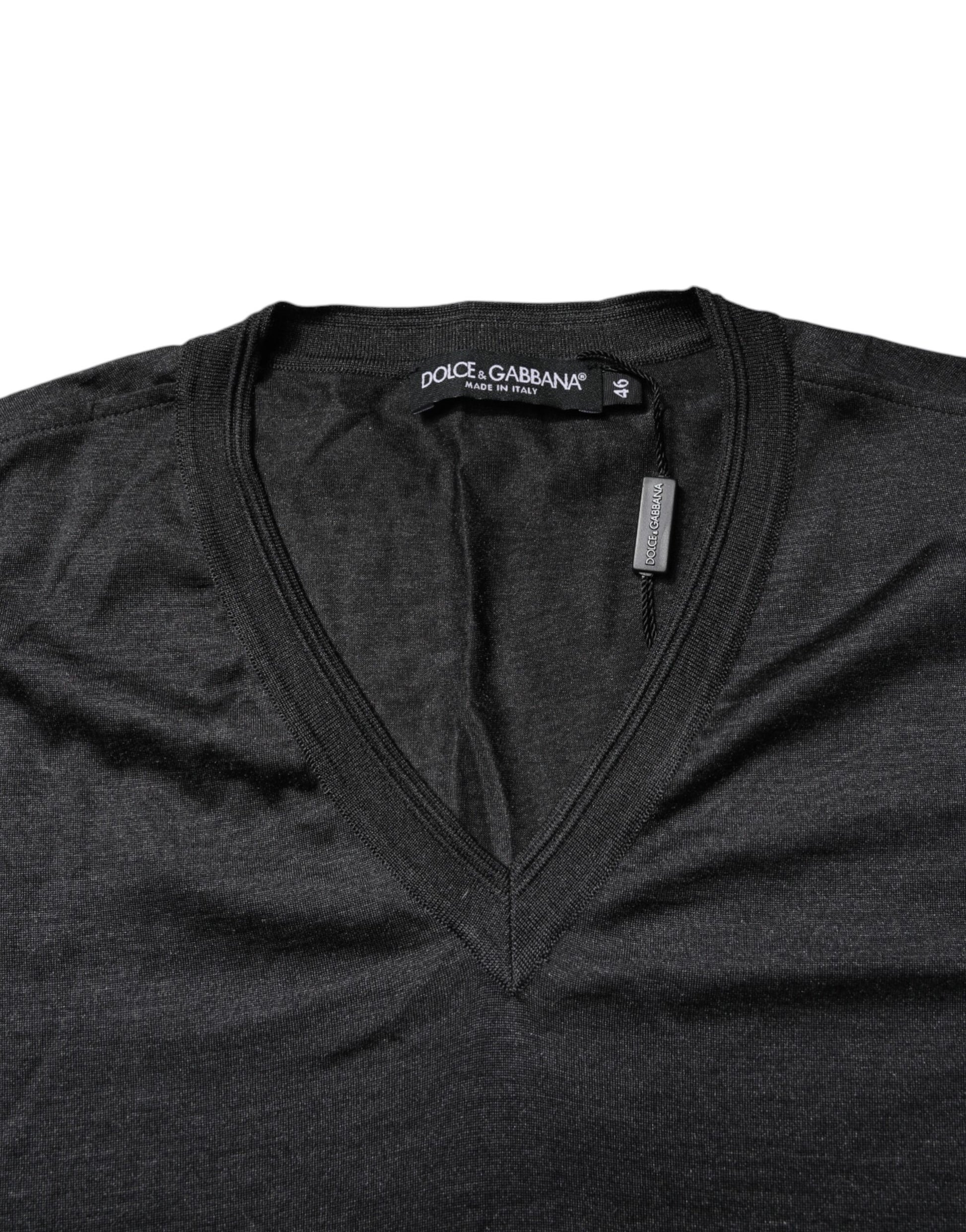 Dark colored sweater on hanger